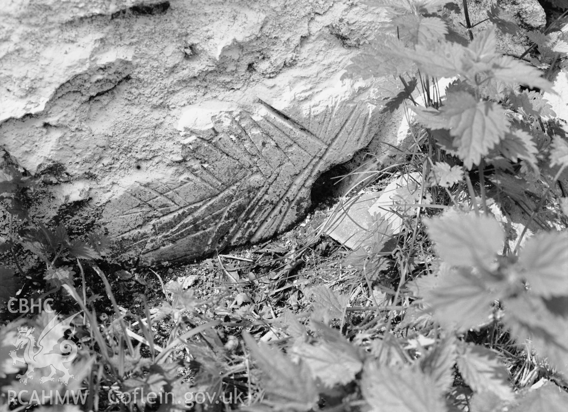 Detail of arrow whetstone in wall