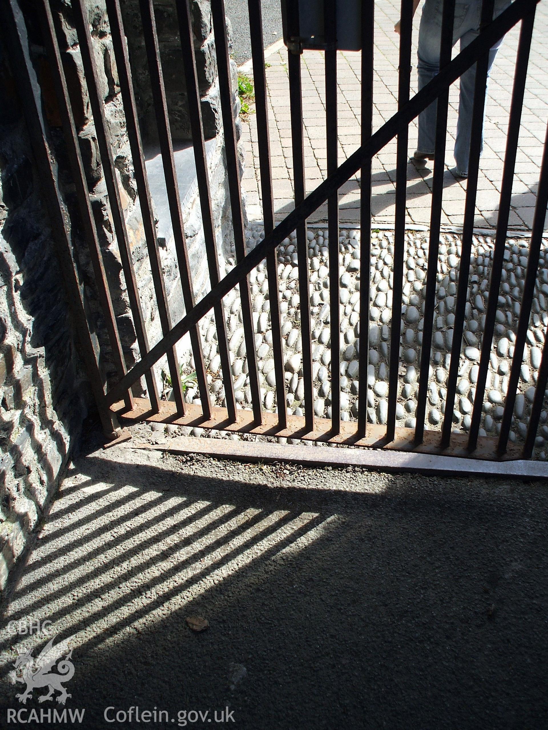 Colour digital photograph of a gate leading into the grounds of St. Padarn's Church, Llanbadarn Fawr.