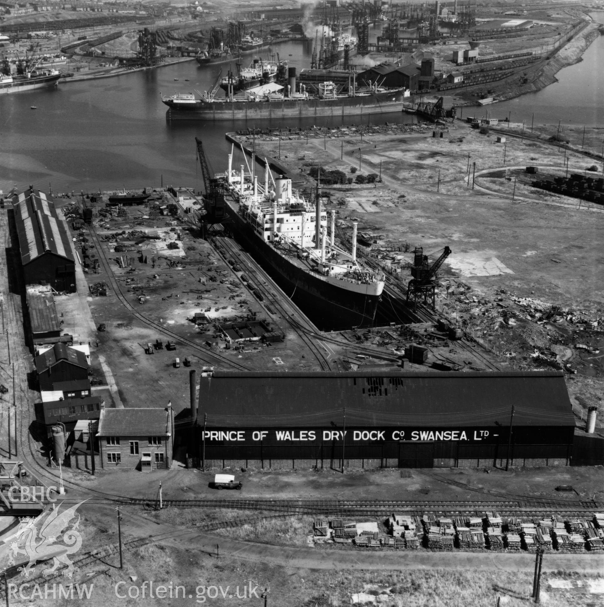 View of Prince of Wales dry dock, Swansea, showing the ship 'Pendeen' in dry dock. Oblique aerial photograph, 5?" cut roll film.