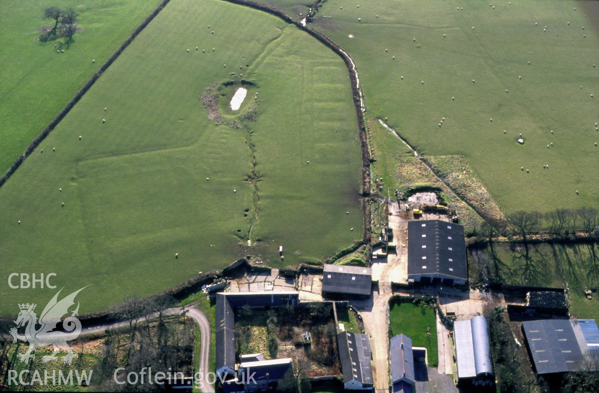 RCAHMW colour slide oblique aerial photograph of Coedcanlas Garden Earthworks, Martletwy, taken by C.R. Musson, 28/01/94