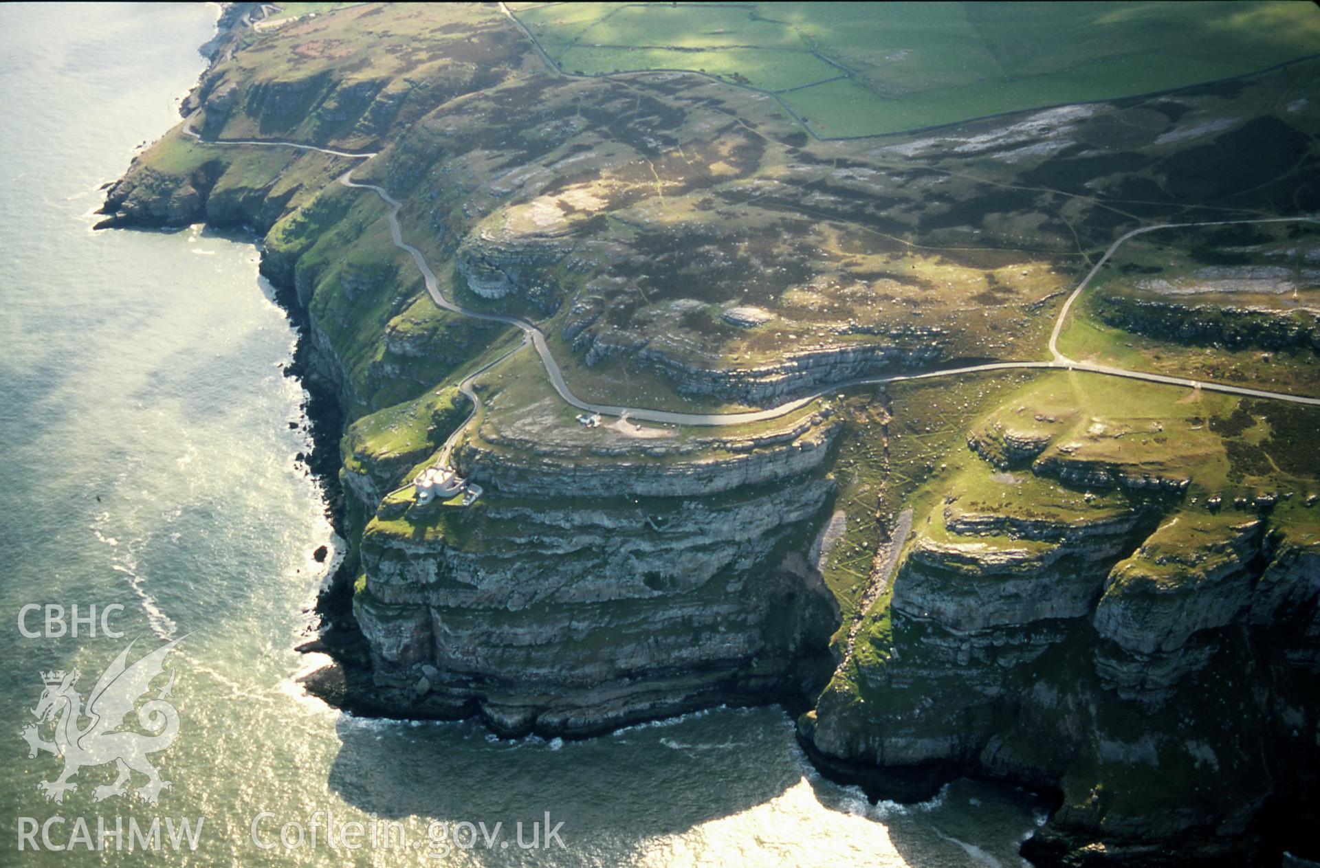 RCAHMW colour slide oblique aerial photograph of Great Ormes Head Light House, Llandudno, taken on 18/04/1998 by Toby Driver