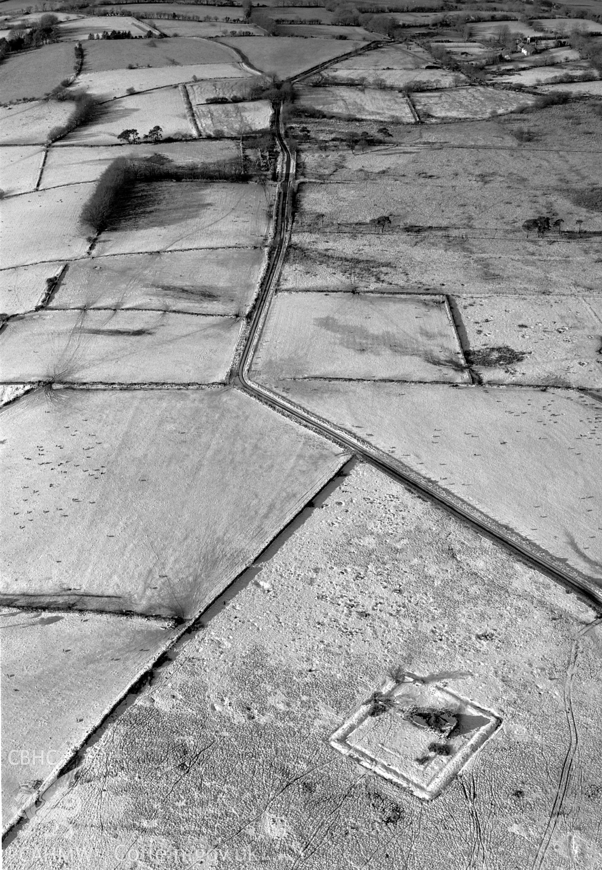 RCAHMW Black and white oblique aerial photograph of Tan-y-bwlch Deserted Homestead, Pistyll Einion, Cellan, taken on 19/12/1999 by Toby Driver