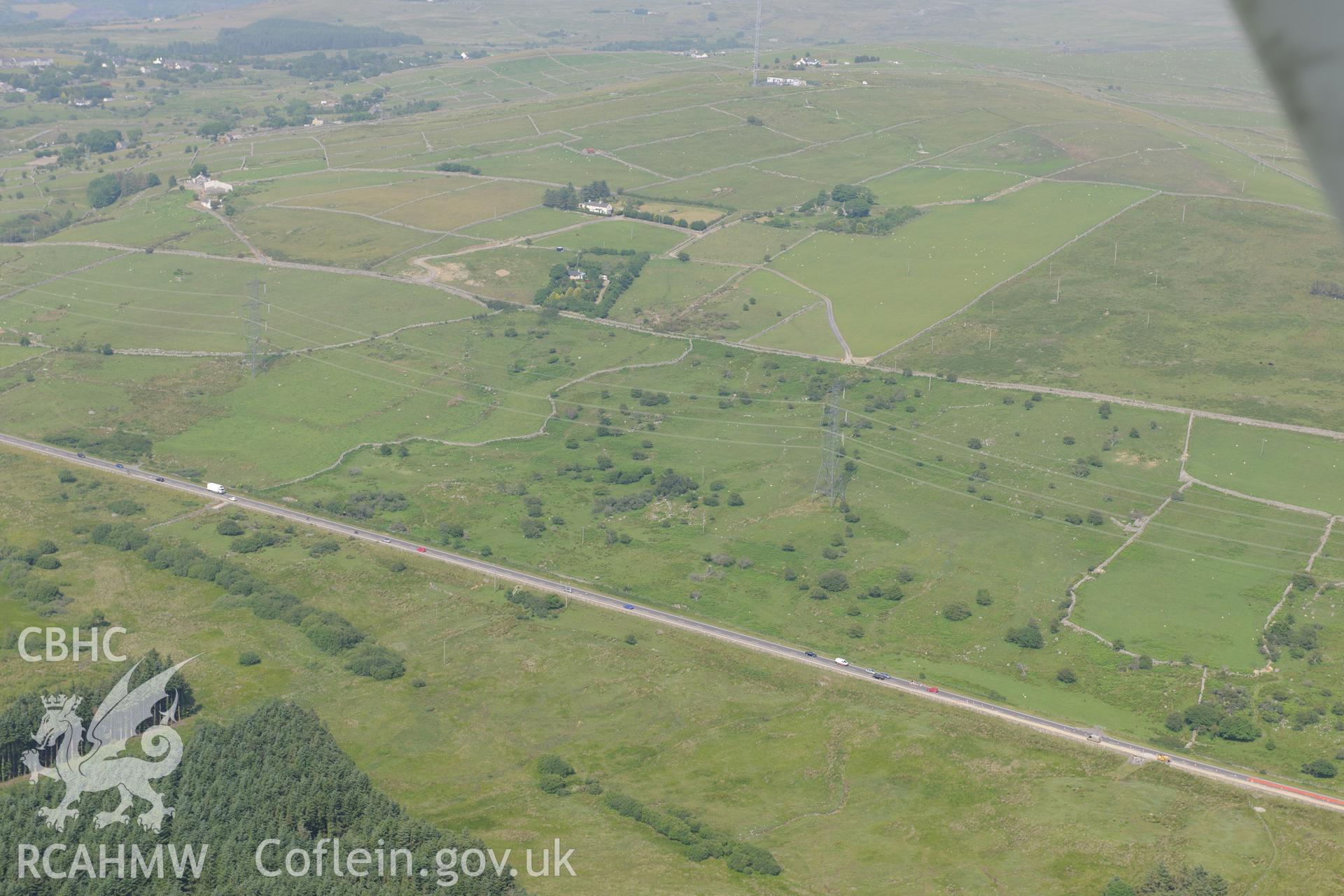 Settlement II at Caerau, Llanllyfni, south of Caernarfon. Oblique aerial photograph taken during the Royal Commission?s programme of archaeological aerial reconnaissance by Toby Driver on 12th July 2013.