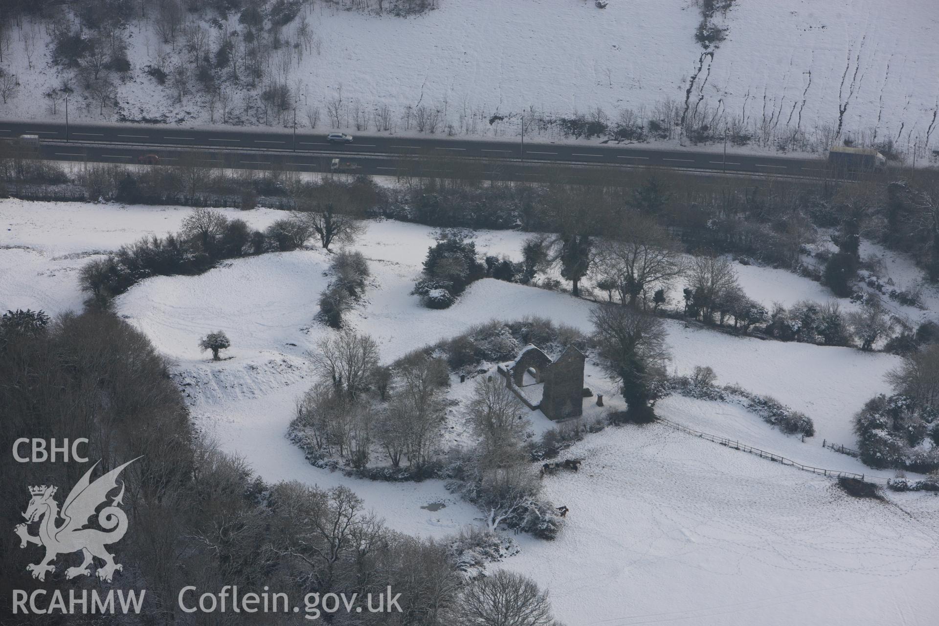 St Mary's church and Caerau Castle ringwork, Caerau, Cardiff. Oblique aerial photograph taken during the Royal Commission?s programme of archaeological aerial reconnaissance by Toby Driver on 24th January 2013.