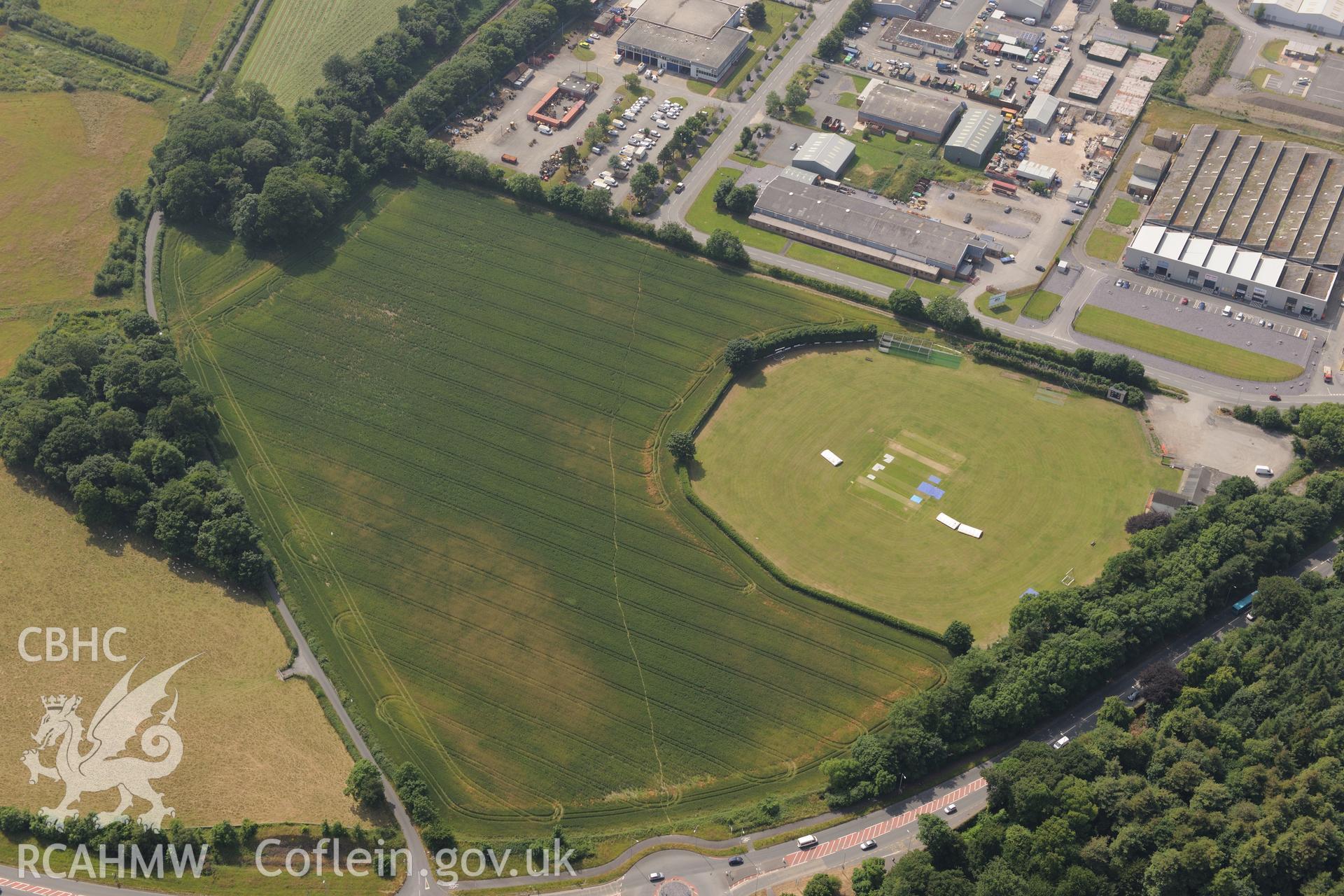 Llandegai henge monuments and cursus. Oblique aerial photograph taken during the Royal Commission?s programme of archaeological aerial reconnaissance by Toby Driver on 12th July 2013.