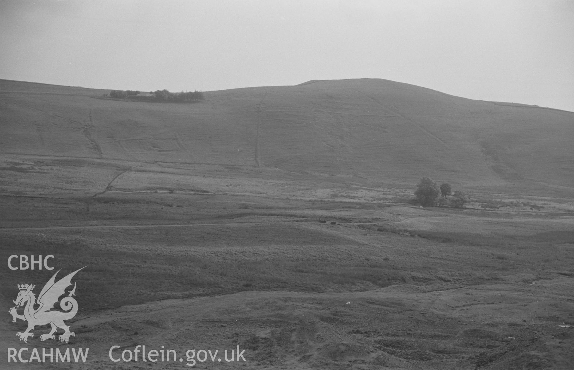 Digital copy of a black and white negative showing Brynmawr with Dyffryn Cottage (top left) from Esgair Mwyn Mine, Ystrad Fflur. Photographed by Arthur O. Chater on 28th August 1966 looking west south west from Grid Reference SN 754 692.