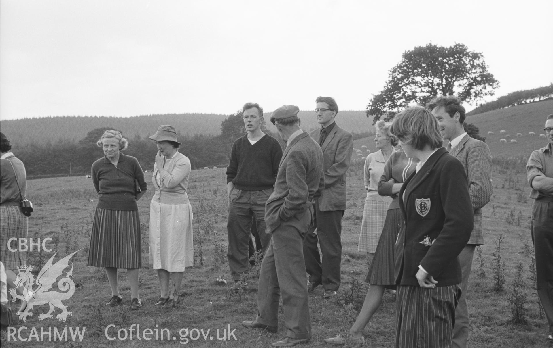 Digital copy of a black and white negative showing the West Wales Field Society outing to Sarn Helen, led by Mr Holder. Photographed in September 1963 by Arthur O. Chater from Grid Reference SN 6628 7210.