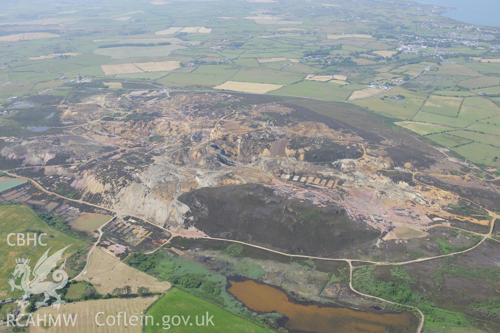 Parys Mountain copper mines, Amlwch, Anglesey. Oblique aerial photograph taken during the Royal Commission?s programme of archaeological aerial reconnaissance by Toby Driver on 12th July 2013.