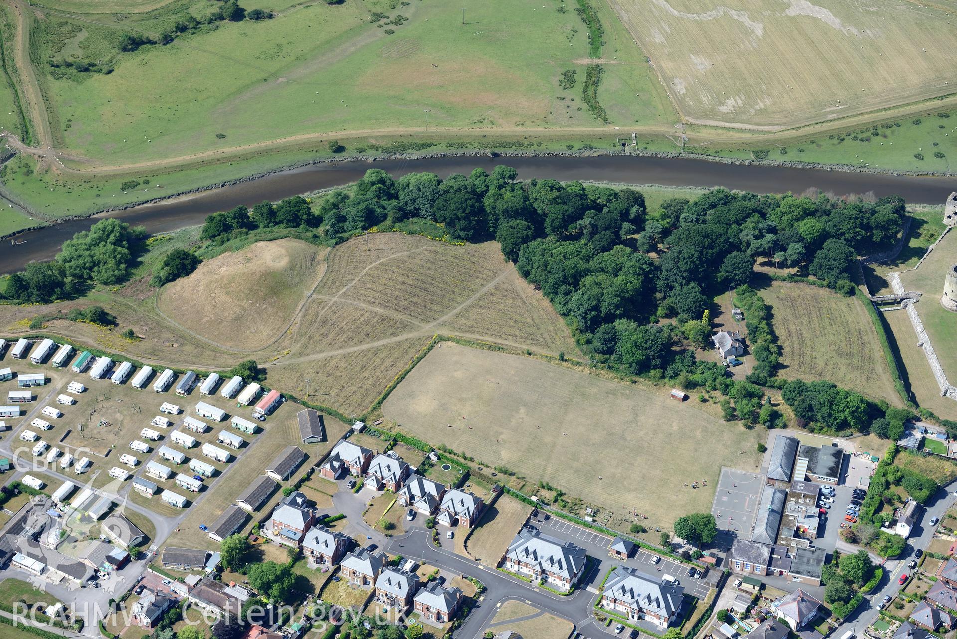 Royal Commission aerial photography of Twt Hill, with parchmarks showing traces of a masonry tower on the summit of the motte, taken on 19th July 2018 during the 2018 drought.