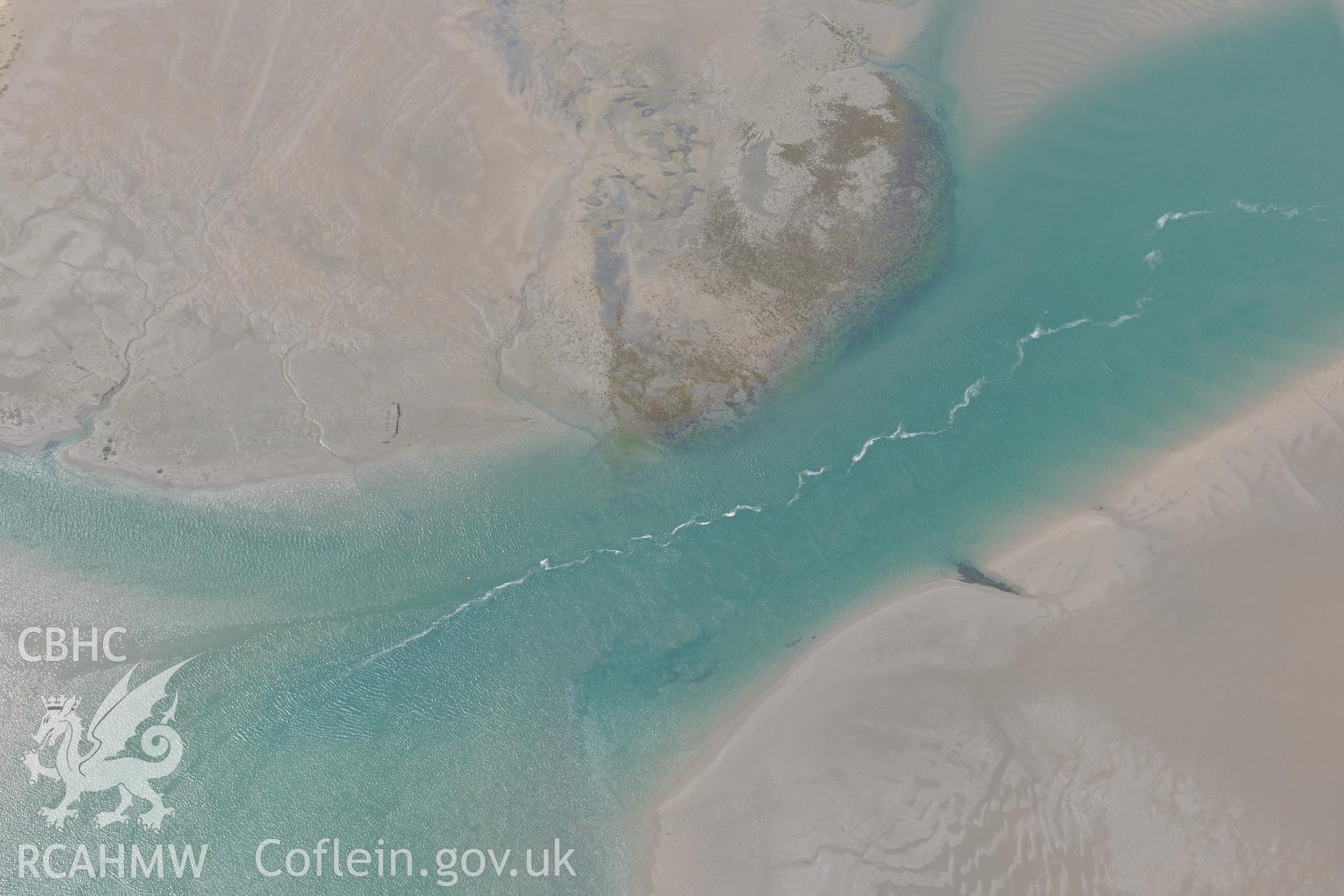 Unnamed Wreck in the Dyfi estuary north of Ynyslas, Aberystwyth. Oblique aerial photograph taken during the Royal Commission?s programme of archaeological aerial reconnaissance by Toby Driver on 12th July 2013.