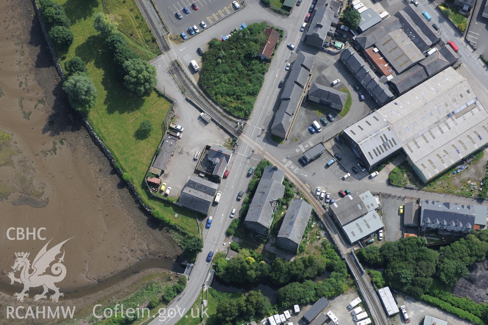 Snowdon Street Corn Mill, Porthmadog. Oblique aerial photograph taken during the Royal Commission?s programme of archaeological aerial reconnaissance by Toby Driver on 12th July 2013.
