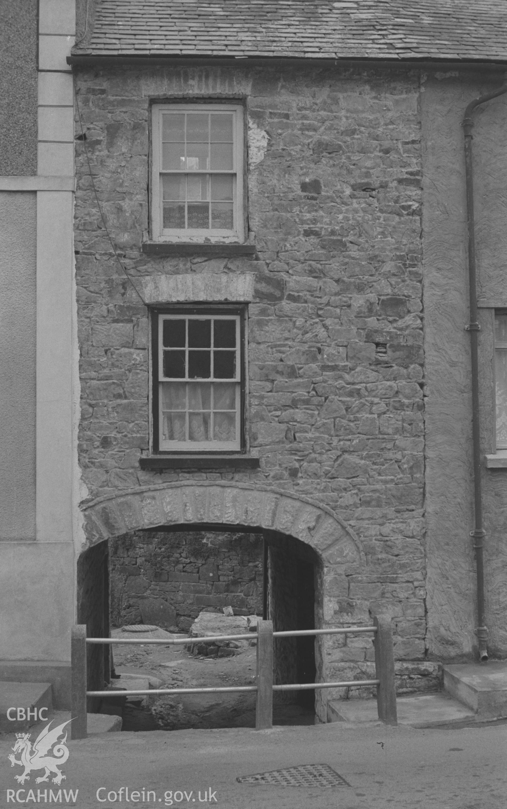 Digital copy of a black and white negative showing archway beneath house at the bottom of Llanarth main street. Photographed by Arthur O. Chater on  13th April 1967 looking north west from Grid Reference SN 424 577.