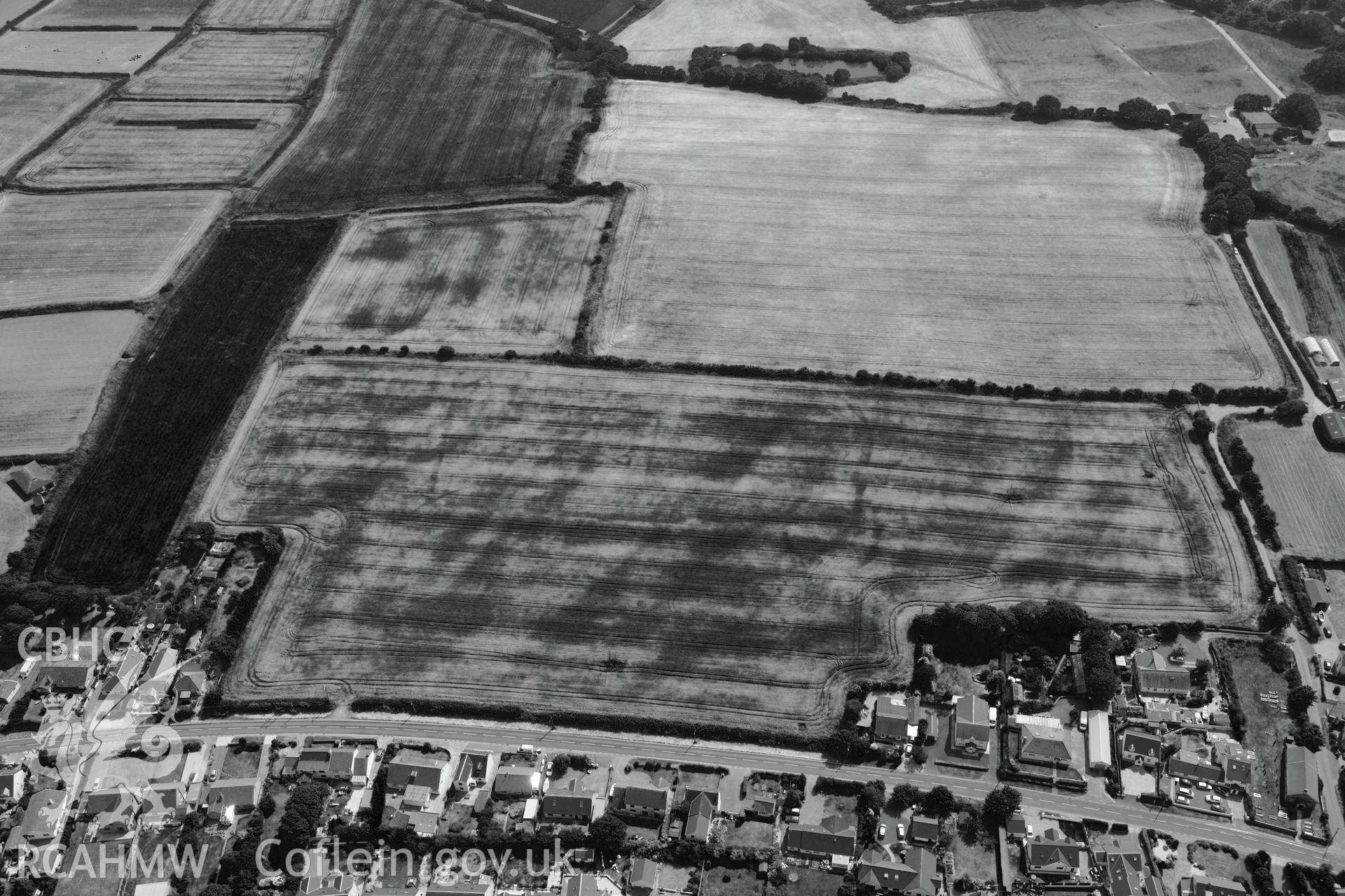 Hearson Farm defended enclosures, Hill Mountain, north east of Milford Haven. Oblique aerial photograph taken during the Royal Commission?s programme of archaeological aerial reconnaissance by Toby Driver on 16th July 2013.