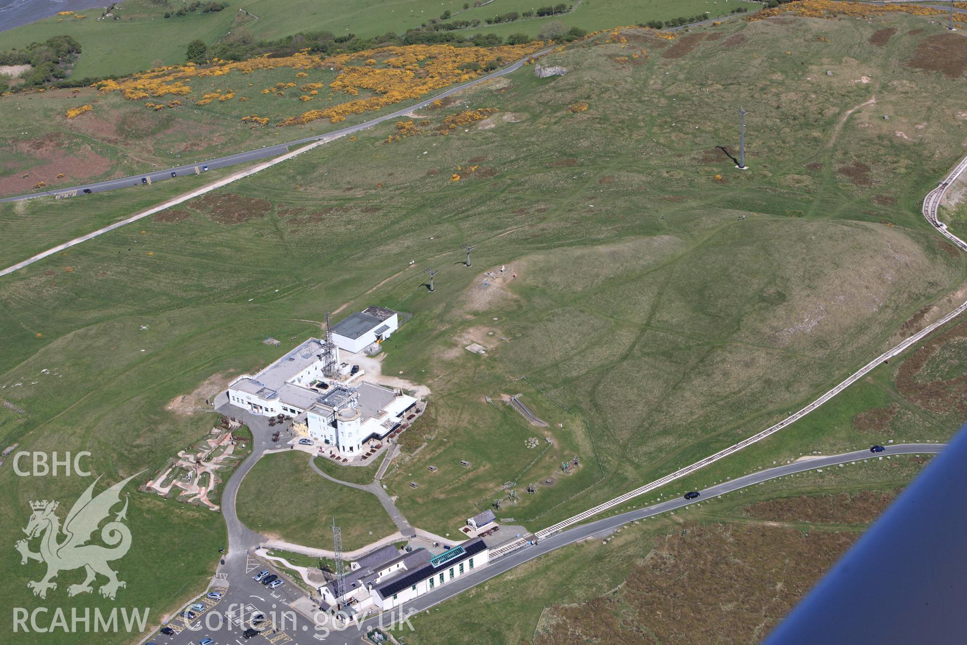 Great Orme visitor centre, Great Ormes Head telegraph station and the Telegraph Hotel. Oblique aerial photograph taken during the Royal Commission?s programme of archaeological aerial reconnaissance by Toby Driver on 22nd May 2013.