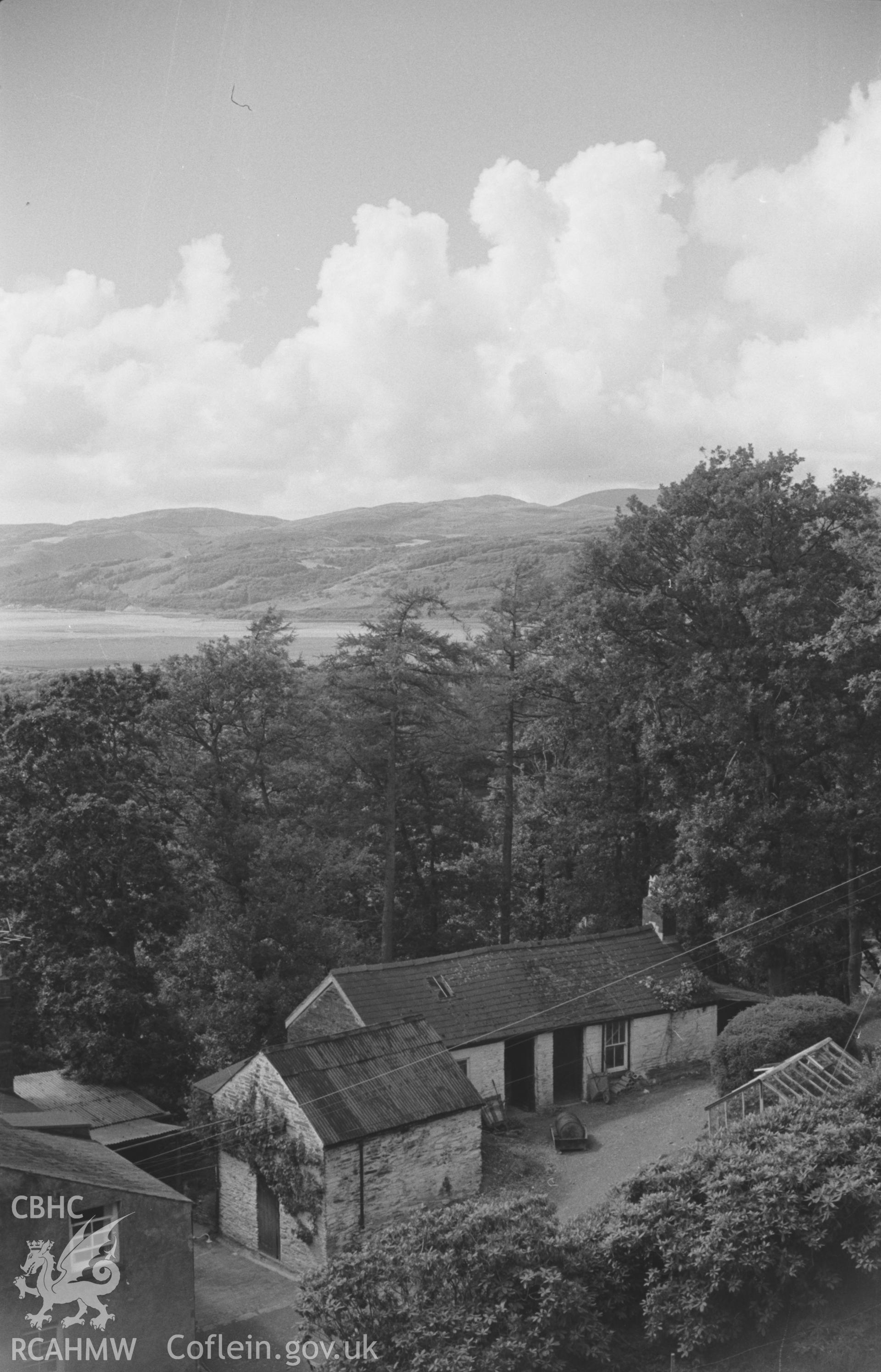 Digital copy of a black and white negative showing view to the Dyfi estuary over the outbuildings at Cymerau farm, Eglwysfach, near Machynlleth. Photographed by Arthur O. Chater in August 1965 looking west from Grid Reference SN 6952 9630.