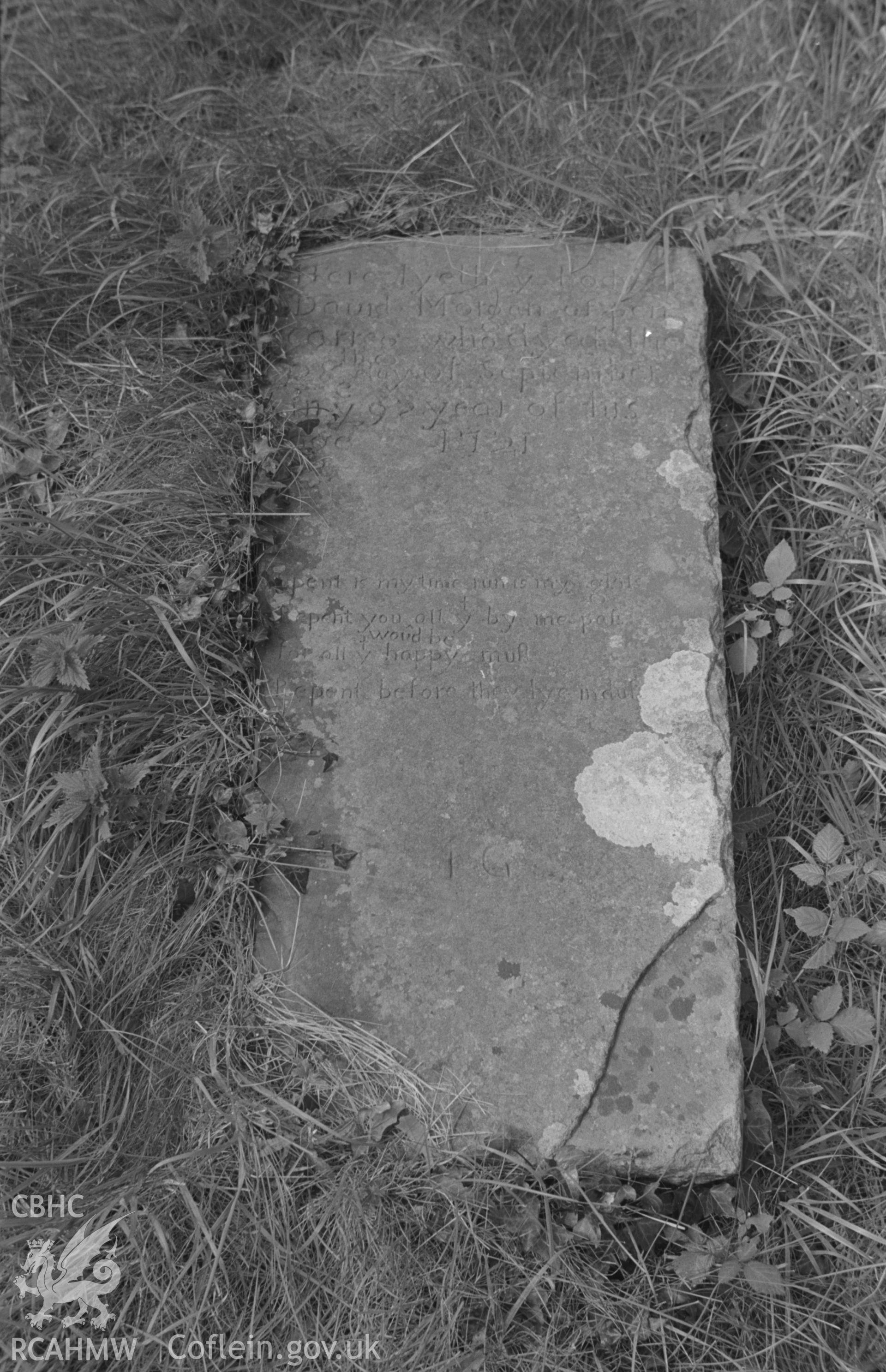 Digital copy of a black and white negative showing the gravestone of David Morgan, dated 1721, at St. Patrick's church, Pencarreg, Lampeter. Photographed in September 1963 by Arthur O. Chater.