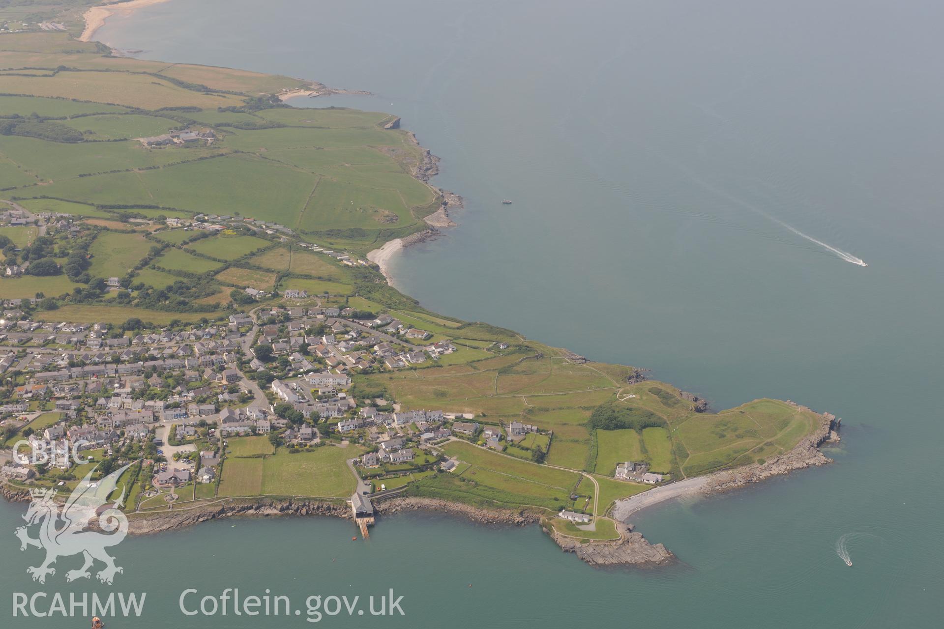 The town of Moelfre, on the east coast of Anglesey. Oblique aerial photograph taken during the Royal Commission?s programme of archaeological aerial reconnaissance by Toby Driver on 12th July 2013.