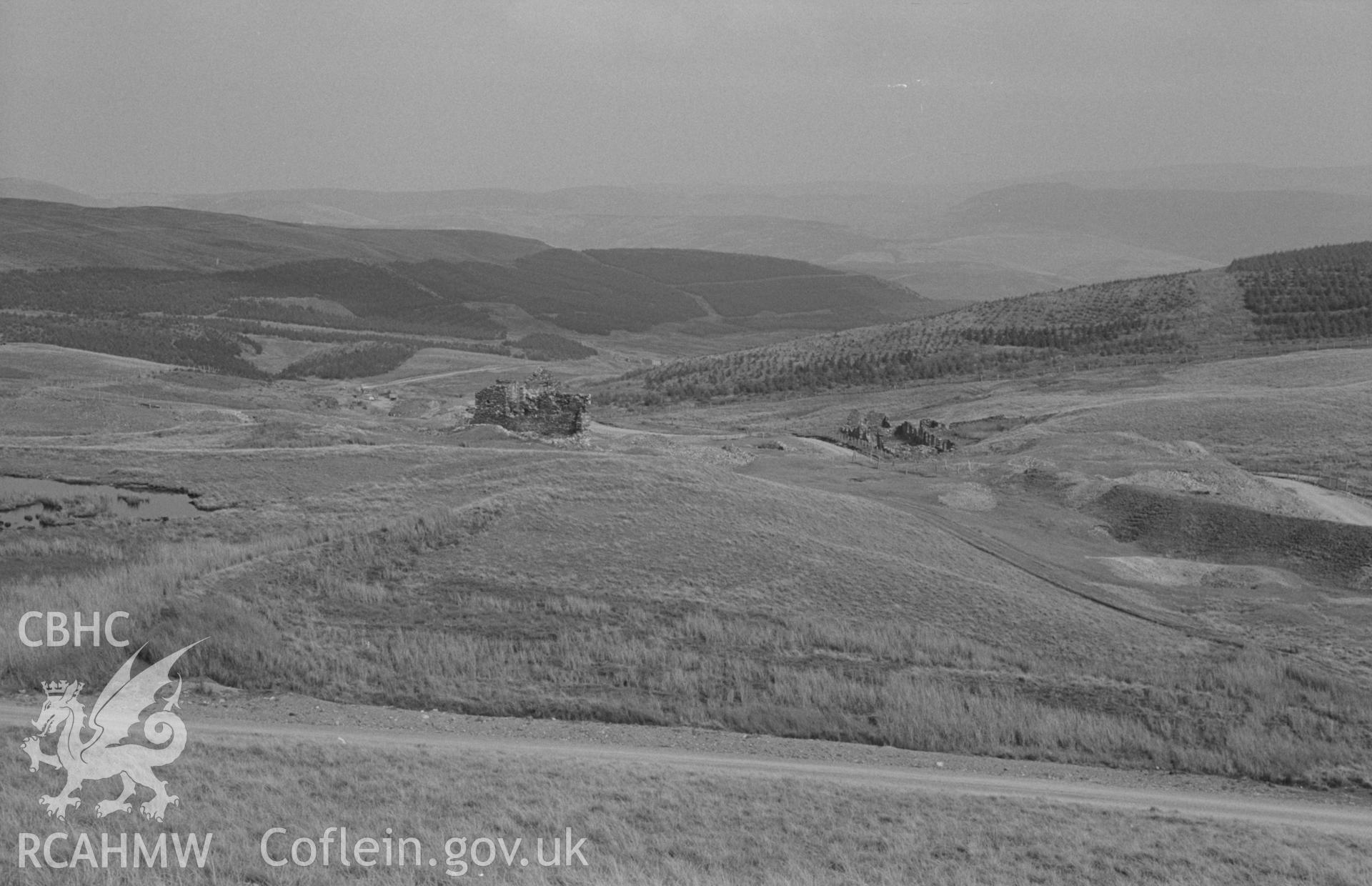 Digital copy of a black and white negative showing panorama of Esgair-Hir mine from Banc Bwlchgarreg; old reservoir on left. Photographed by Arthur O. Chater on 22nd August 1967, looking east from Grid Reference SN 732 913. (Photograph 1 of 3).