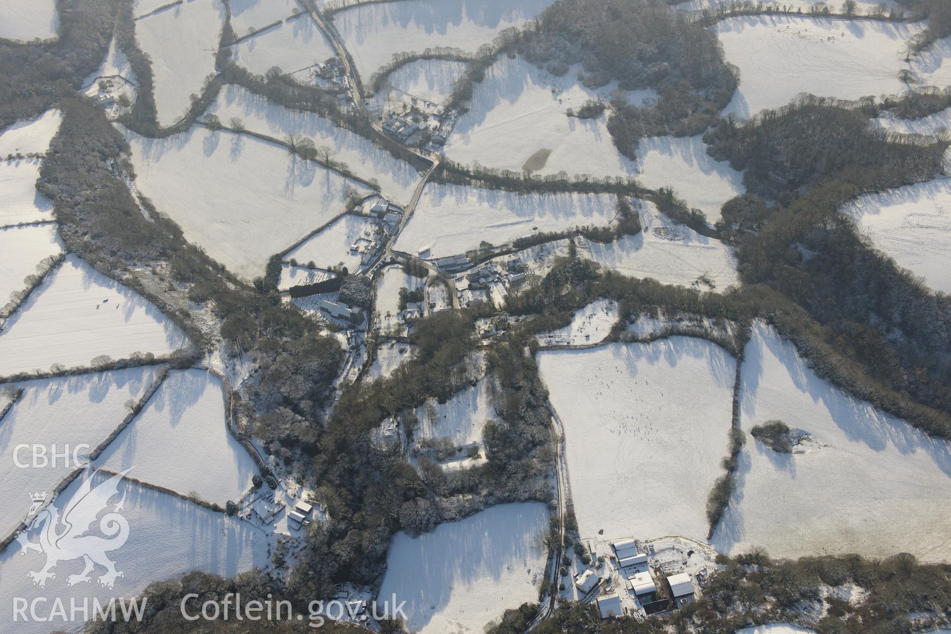 Nevern castle and the surrounding town, between Cardigan and Fishguard. Oblique aerial photograph taken during the Royal Commission?s programme of archaeological aerial reconnaissance by Toby Driver on 24th January 2013.