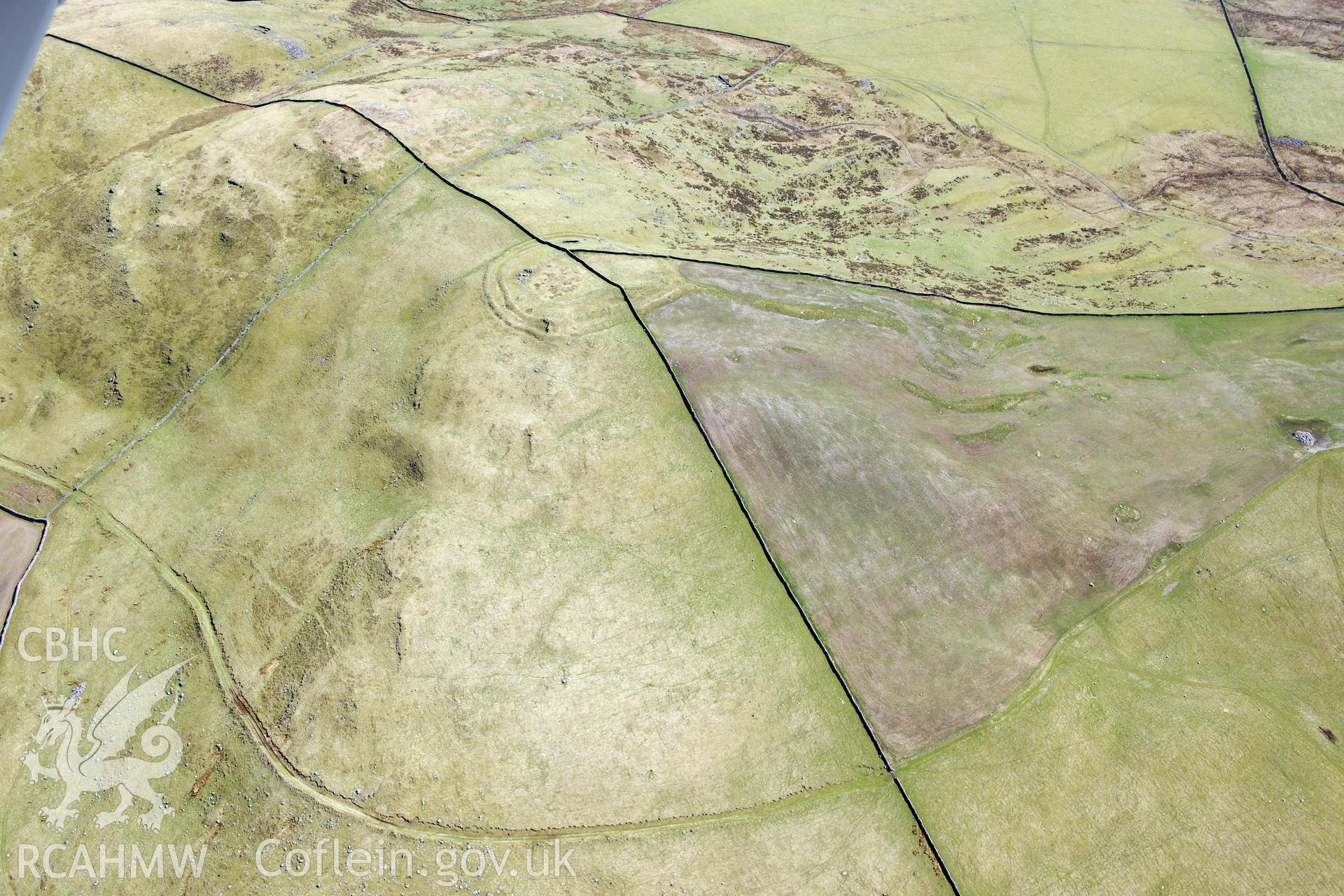 Moel Goedog hillfort, east of Harlech. Oblique aerial photograph taken during the Royal Commission?s programme of archaeological aerial reconnaissance by Toby Driver on 1st May 2013.