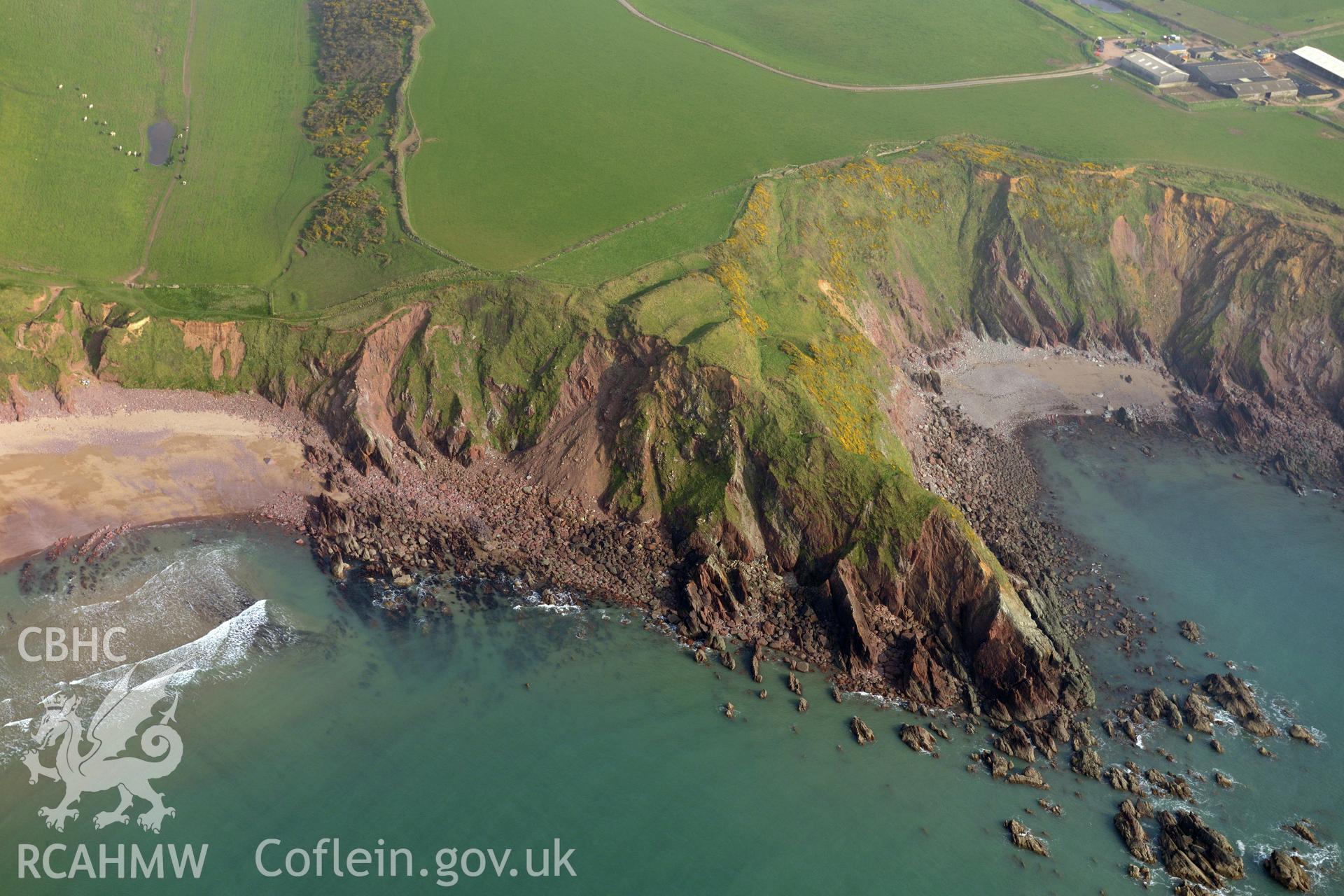 Aerial photography of Great Castle Head taken on 27th March 2017. Baseline aerial reconnaissance survey for the CHERISH Project. ? Crown: CHERISH PROJECT 2017. Produced with EU funds through the Ireland Wales Co-operation Programme 2014-2020. All material made freely available through the Open Government Licence.