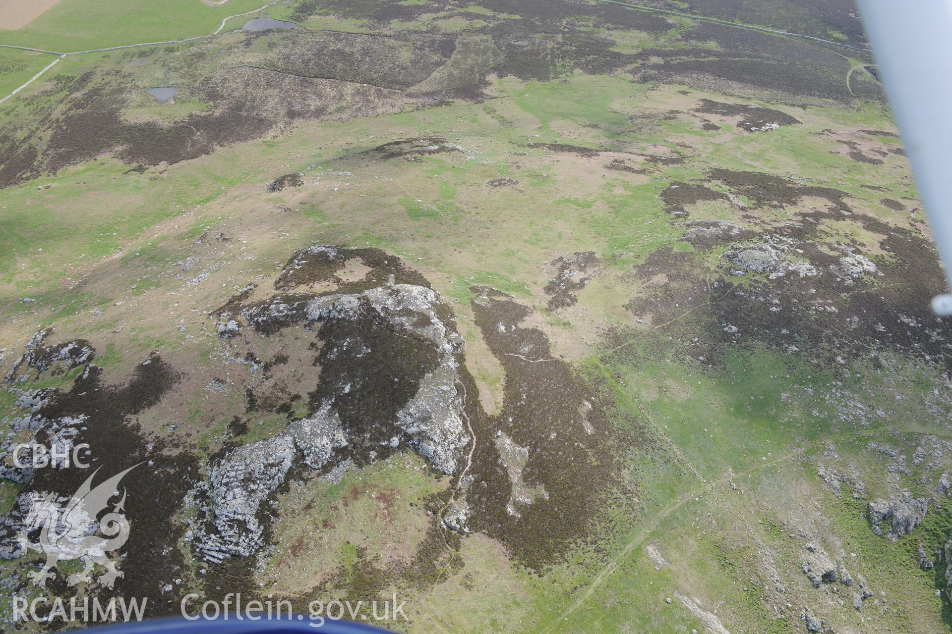 Carn Llundain and its relict field walls on Ramsey Island. Oblique aerial photograph taken during the Royal Commission's programme of archaeological aerial reconnaissance by Toby Driver on 13th May 2015.