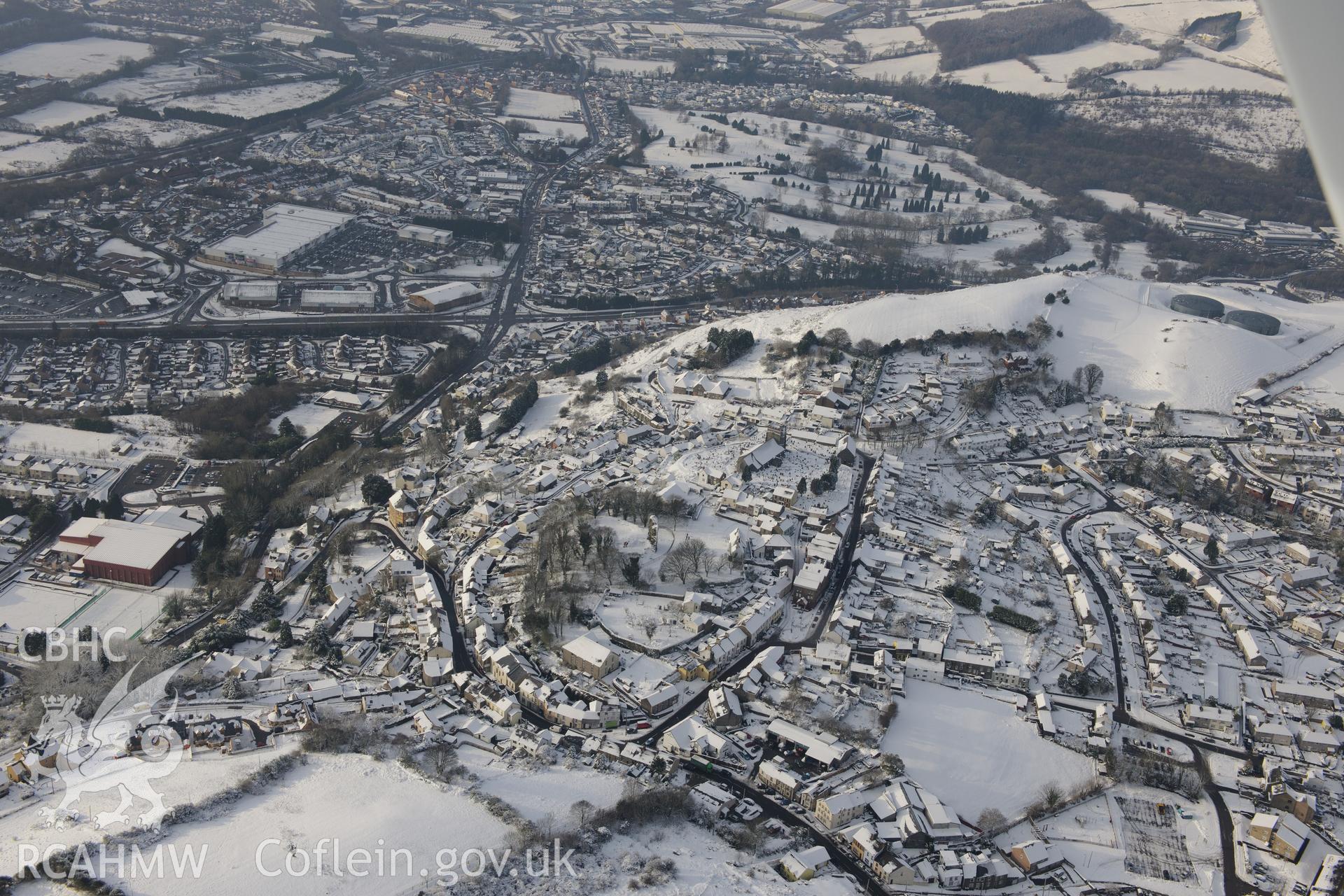 The church of Saints Illtyd, Gwyno and Tyfodwg, and Llantrisant Castle, Llantrisant, north west of Cardiff. Oblique aerial photograph taken during the Royal Commission?s programme of archaeological aerial reconnaissance by Toby Driver on 24th January 2013.
