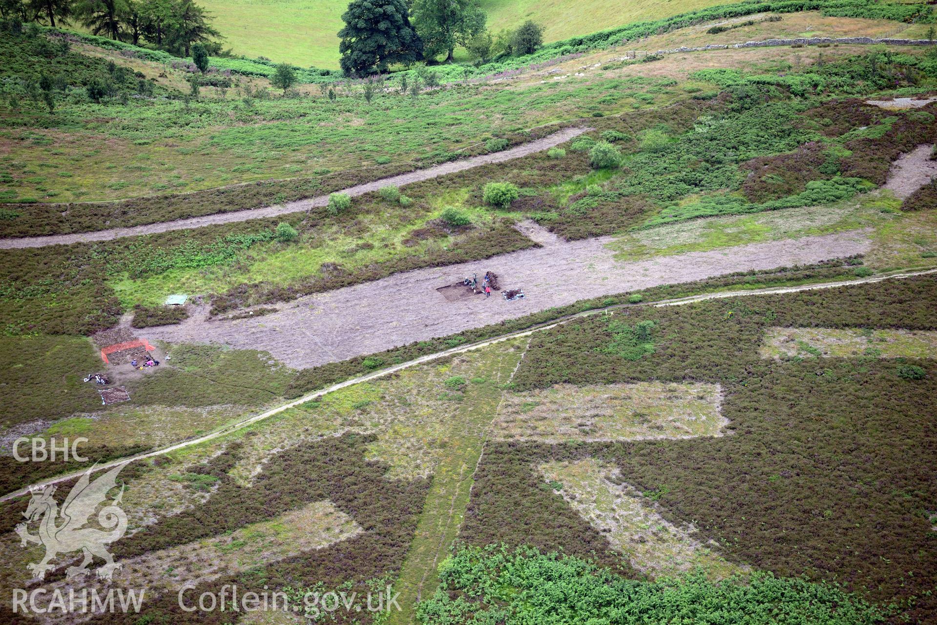 Moel Arthur Hillfort. Excavation by Liverpool University. Oblique aerial photograph taken during the Royal Commission's programme of archaeological aerial reconnaissance by Toby Driver on 30th July 2015.