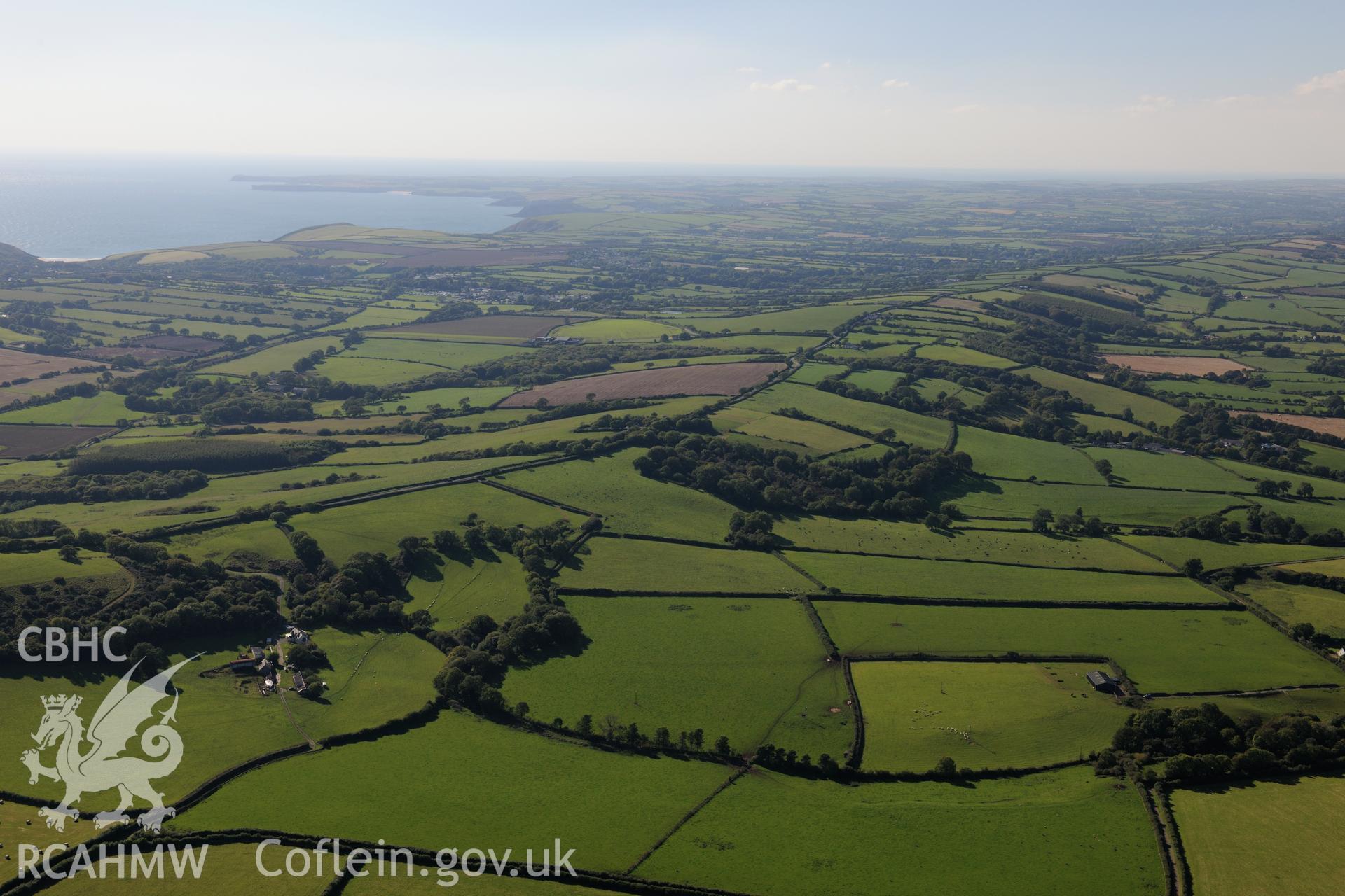 View of Palmerslake farm, Penally, west of Tenby, looking towards the south Wales coast. Oblique aerial photograph taken during the Royal Commission's programme of archaeological aerial reconnaissance by Toby Driver on 30th September 2015.