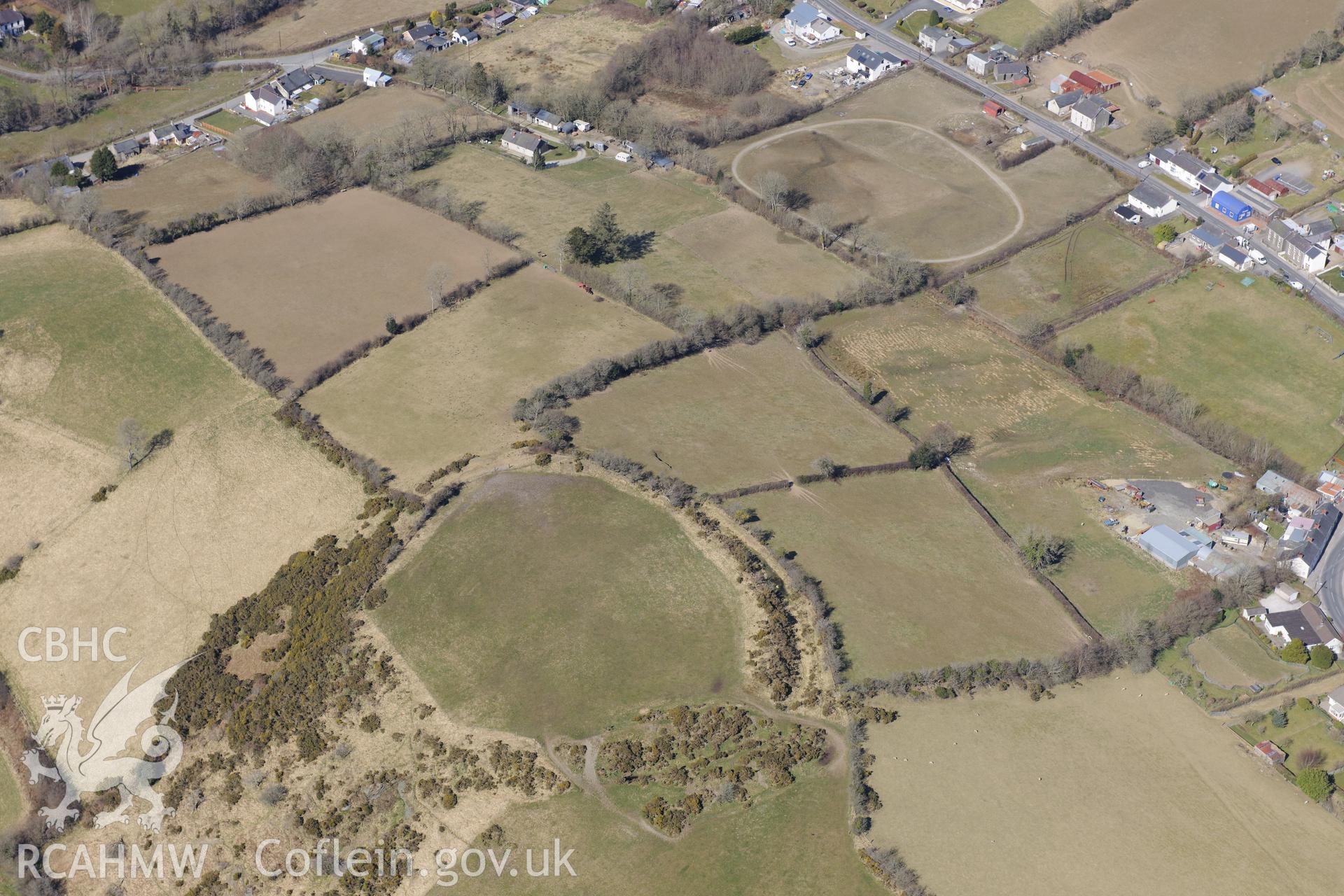 The village of Cribyn and Gaer Maesmynach hillfort, north west of Lampeter. Oblique aerial photograph taken during the Royal Commission's programme of archaeological aerial reconnaissance by Toby Driver on 2nd April 2013.