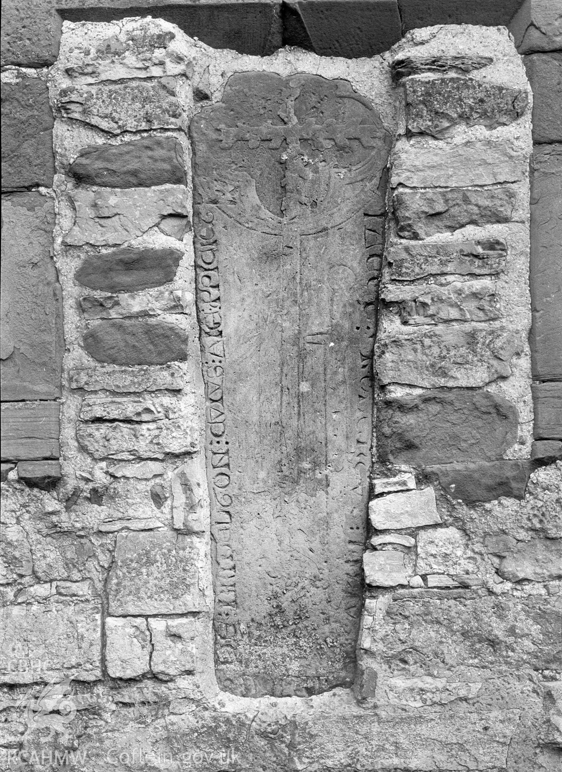 Digital copy of a nitrate negative showing view of inscribed stones in vicarage wall at the  Friary near Rhuddlan Church,  taken by Leonard Monroe.