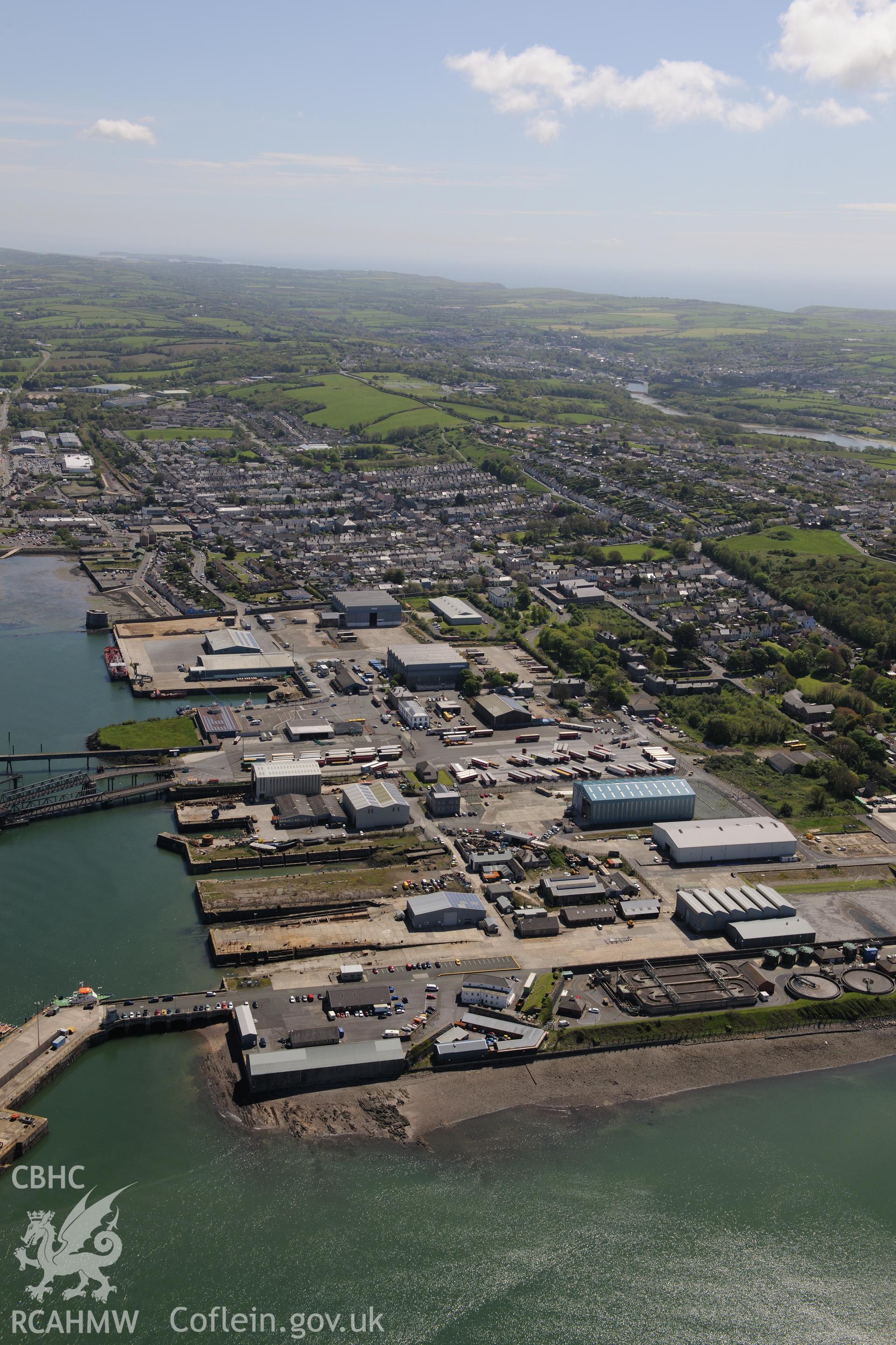 Pembroke Royal Dockyard and the dry dock at Pembroke Dockyard, Pembroke Dock. Oblique aerial photograph taken during the Royal Commission's programme of archaeological aerial reconnaissance by Toby Driver on 13th May 2015.