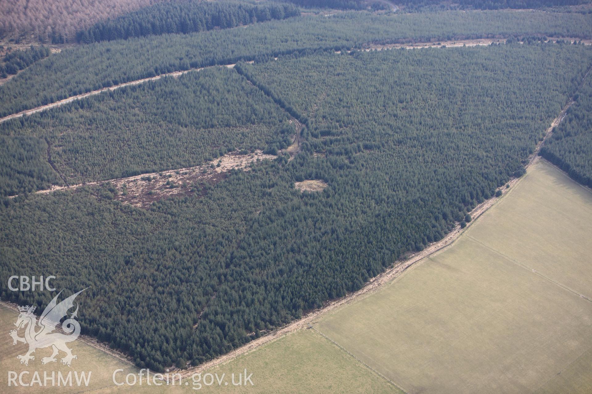 Crugyn Amlwg round barrow, Llanfihangel-ar-arth, south east of Llandysul. Oblique aerial photograph taken during the Royal Commission?s programme of archaeological aerial reconnaissance by Toby Driver on 28th February 2013.