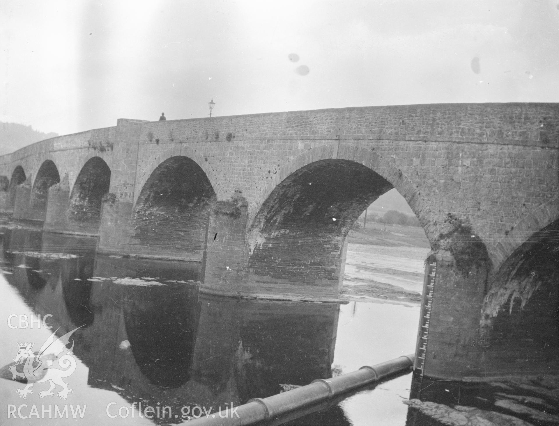 Digital copy of nitrate negative showing Builth Road Bridge over the river Wye. Reverse of black and white photograph reads: Builth / built 1779. James Parry of Hay.' From the Cadw Monuments in Care Collection.