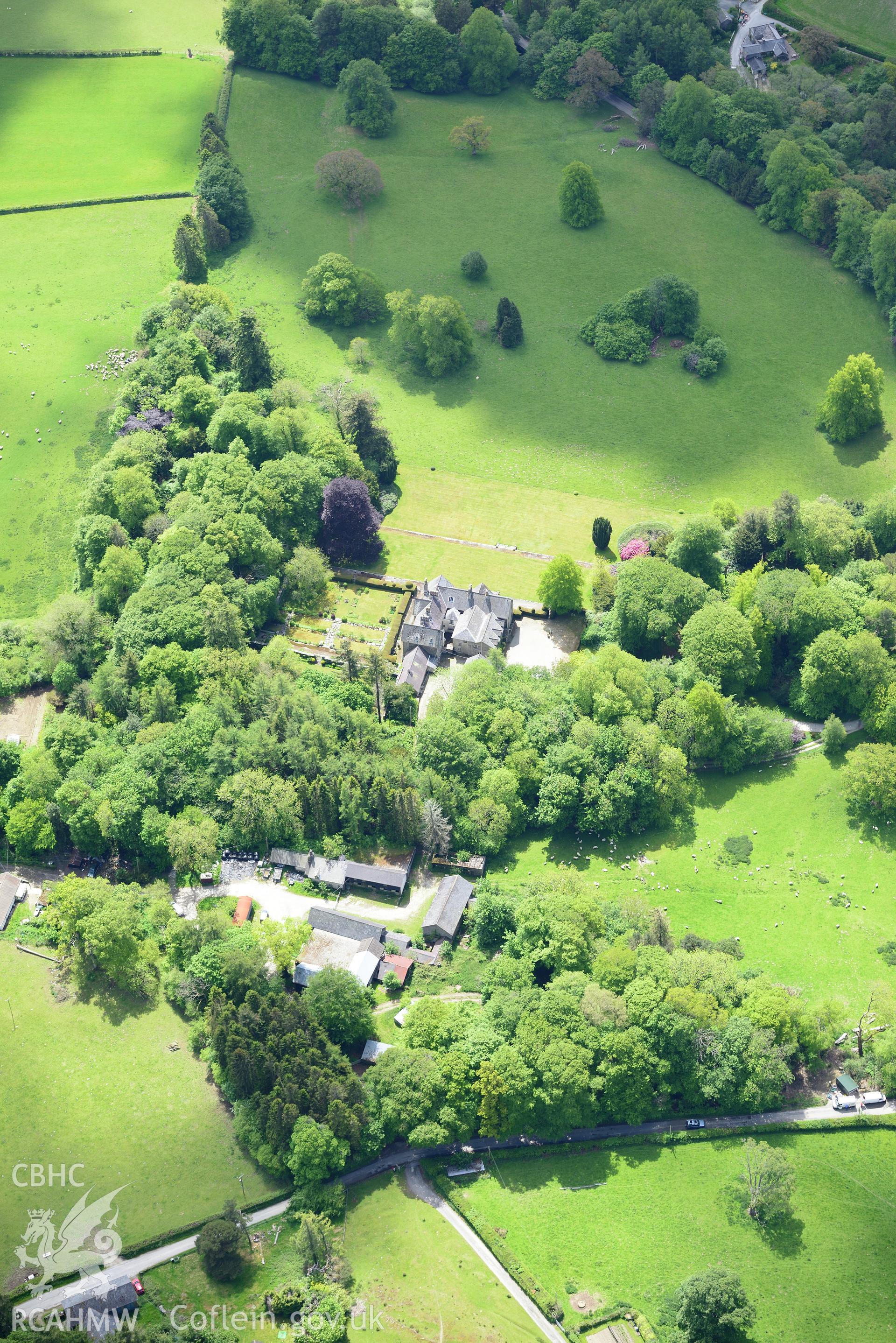 Derw country house and garden and Derw home farm including cowhouse, barn, sawmill, stable and cartshed. Oblique aerial photograph taken during the Royal Commission's programme of archaeological aerial reconnaissance by Toby Driver on 3rd June 2015.