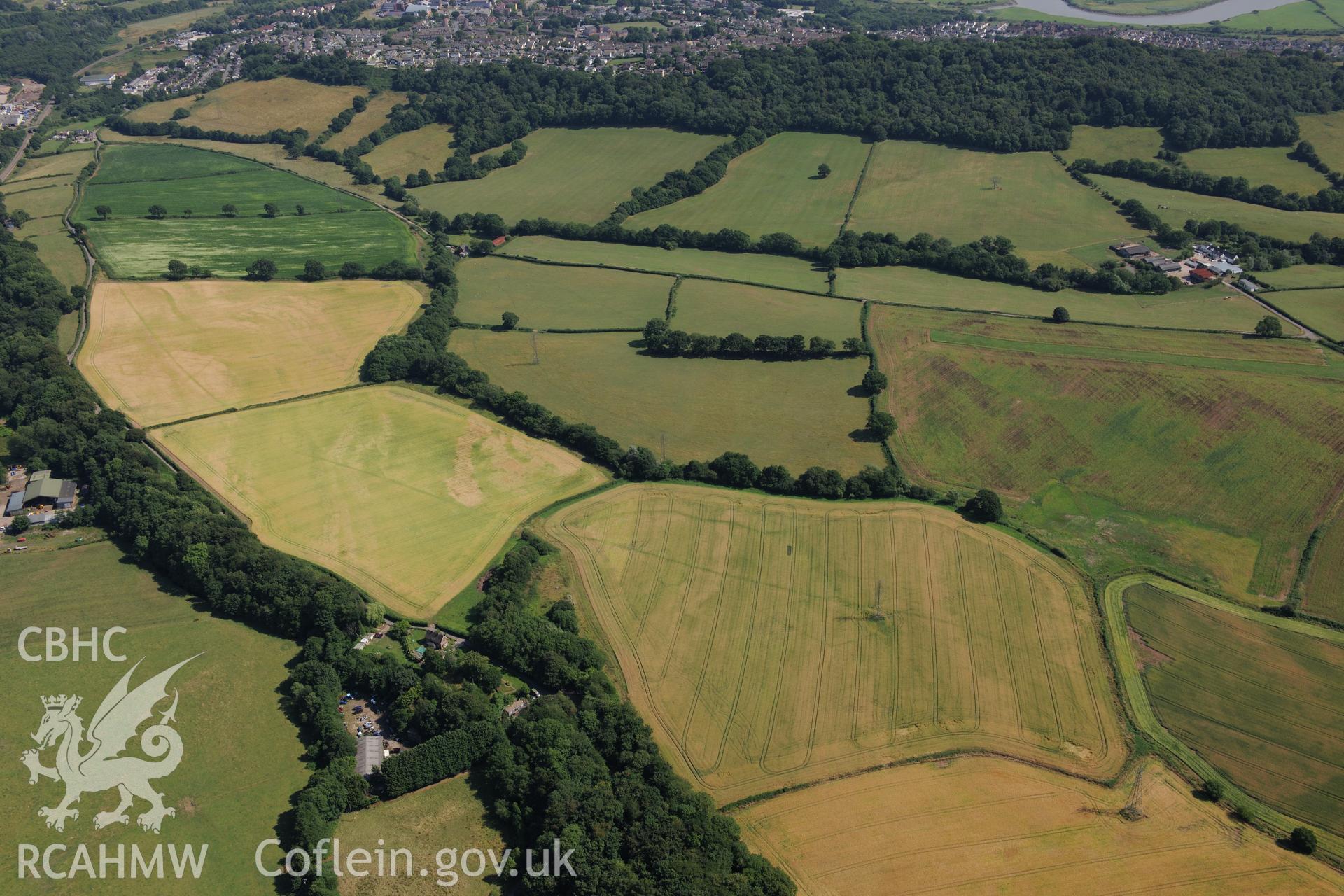 Malthouse Road defended enclosure, between Caerleon and Cwmbran. Oblique aerial photograph taken during the Royal Commission?s programme of archaeological aerial reconnaissance by Toby Driver on 1st August 2013.
