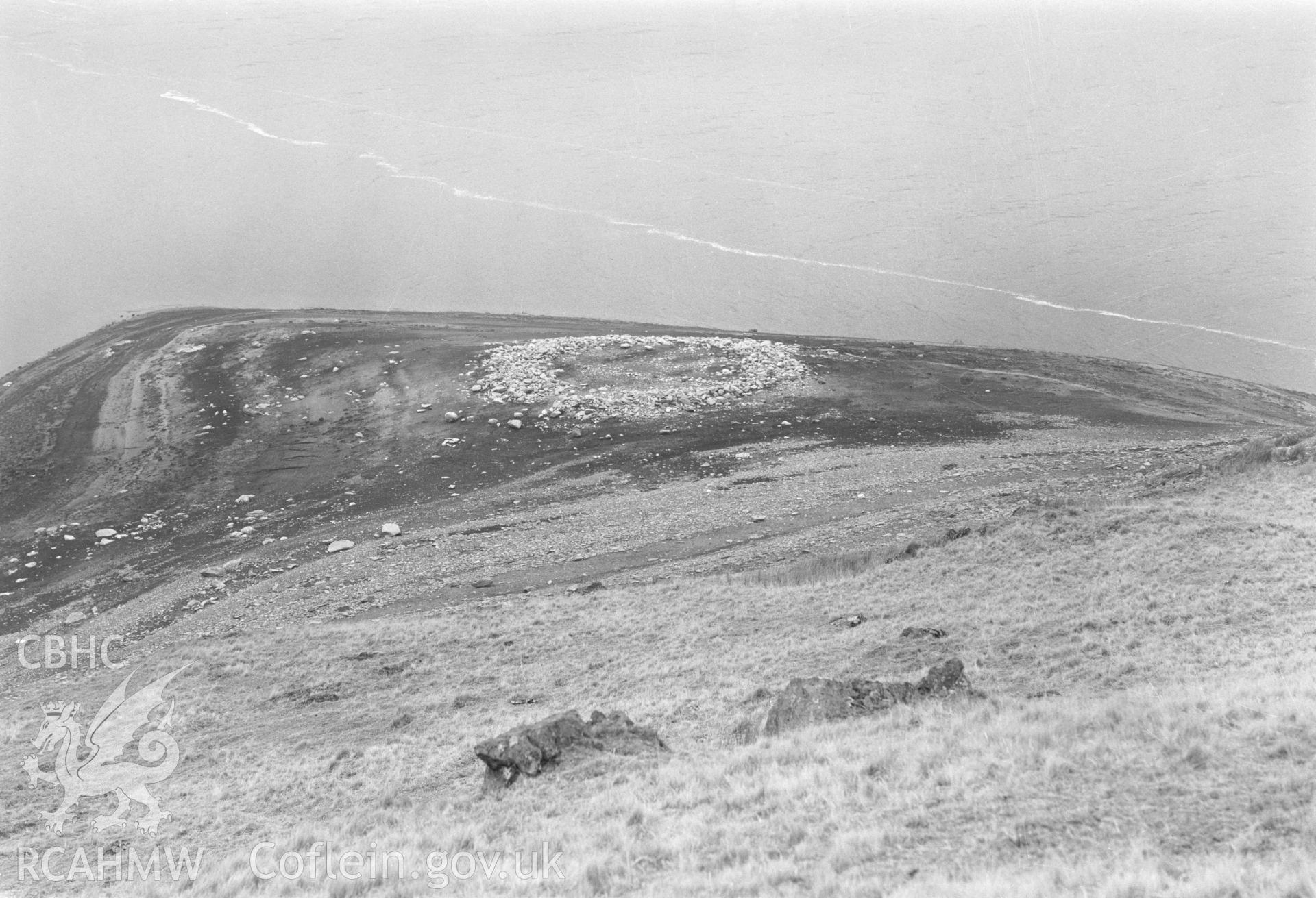 Digital copy of a black and white nitrate negative showing a view of Aber Camddwr cairn, taken by RCAHMW, undated.