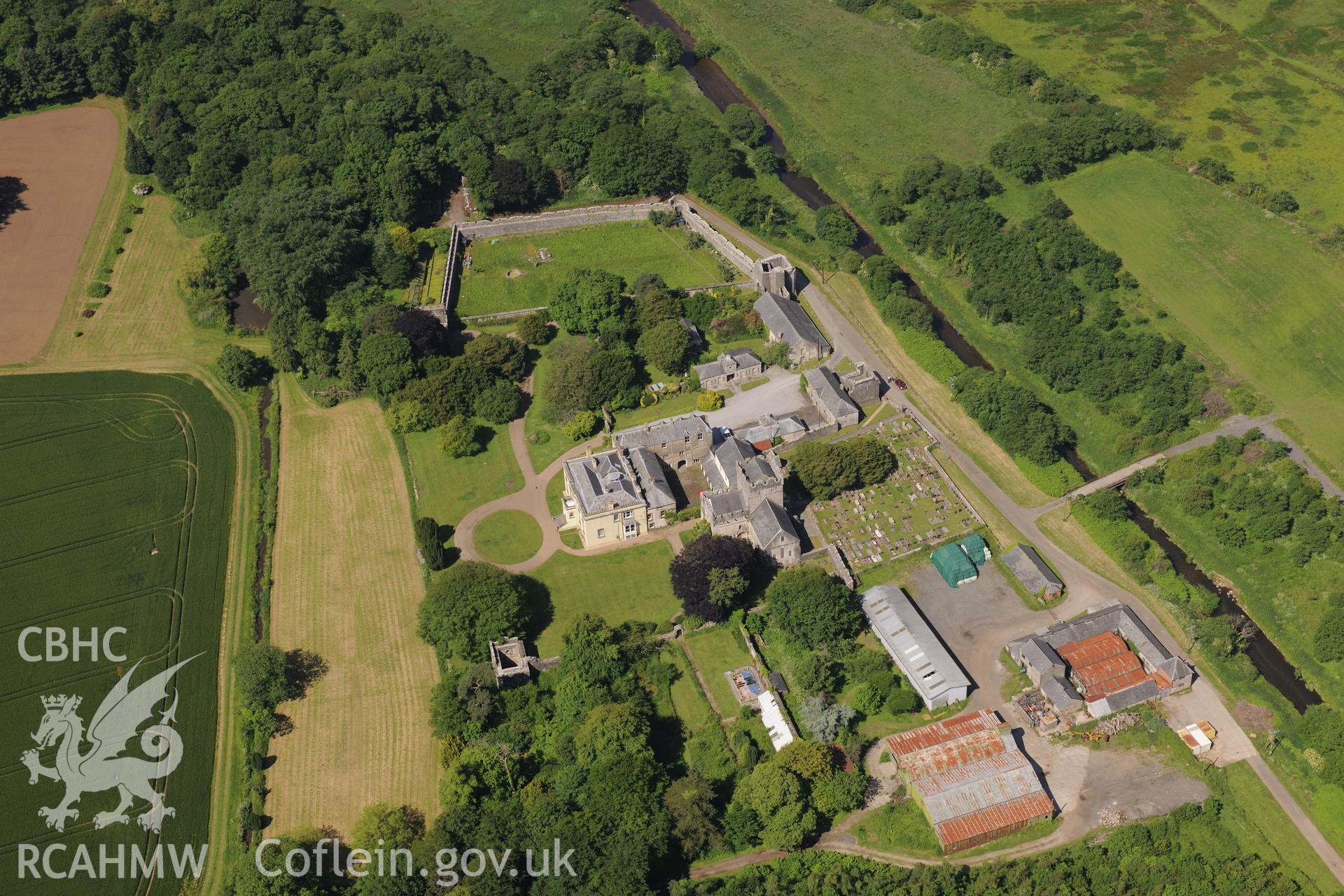 Ewenny Priory including views of the south and north gatehouses; Priory House; dovecote; north tower and St. Michael's church. Oblique aerial photograph taken during the Royal Commission's programme of archaeological aerial reconnaissance by Toby Driver on 19th June 2015.