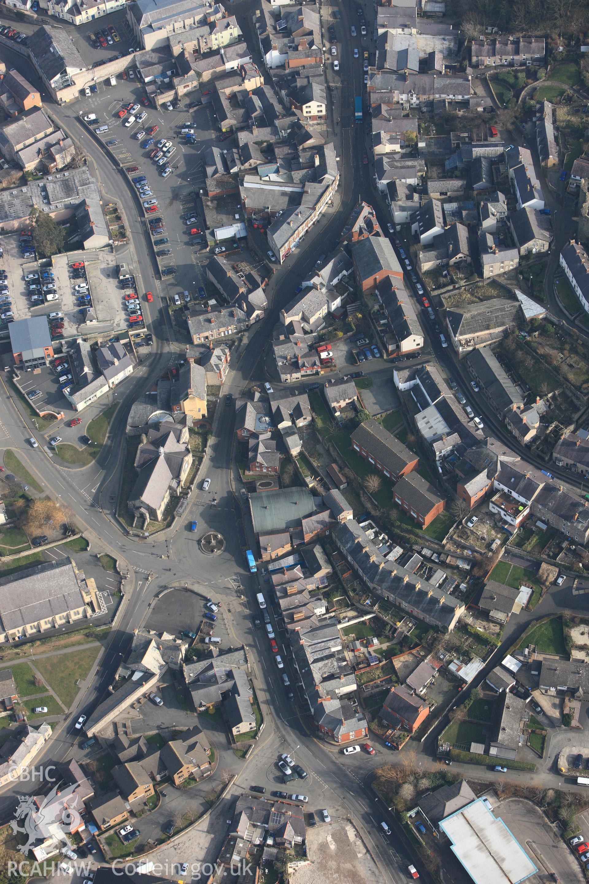 The church hall and Denbigh Drill hall facing one another across Bridge Street, Denbigh, with St. Mary's church on the bottom left hand side of the photograph. Oblique aerial photograph taken during the Royal Commission?s programme of archaeological aerial reconnaissance by Toby Driver on 28th February 2013.