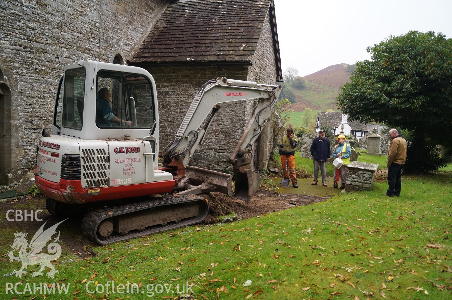 'Looking northeast at eastern part of path from just beyond west end of church to porch. Area scraped off & under most of it was a metalled surface,' St.Mary's church, Gladestry. Photograph & description by Jenny Hall & Paul Sambrook of Trysor, 16/10/2017.