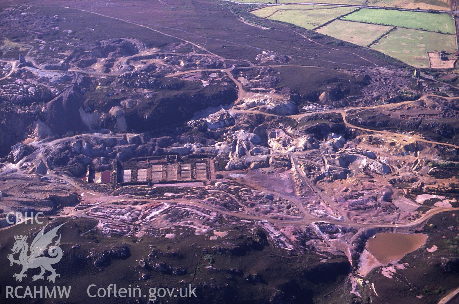 Slide of RCAHMW colour oblique aerial photograph of Parys Mountain Copper Mines, Amlwch, taken by C.R. Musson, 11/7/1989.