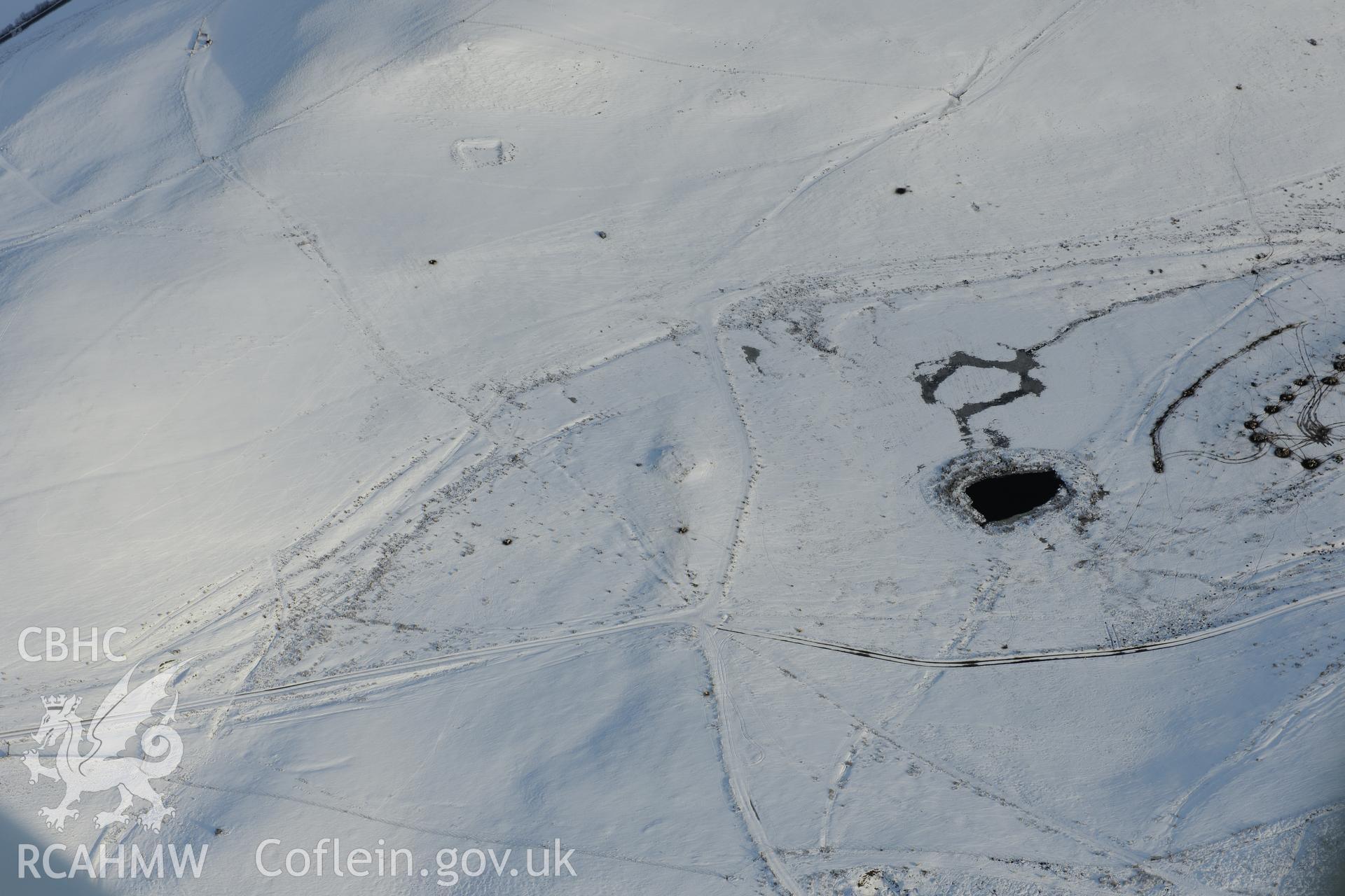 Bryn-y-Maen barrow and Four Stones pillow mound or stone alignment, Bryn-y-Maen, New Radnor. Oblique aerial photograph taken during the Royal Commission?s programme of archaeological aerial reconnaissance by Toby Driver on 15th January 2013.