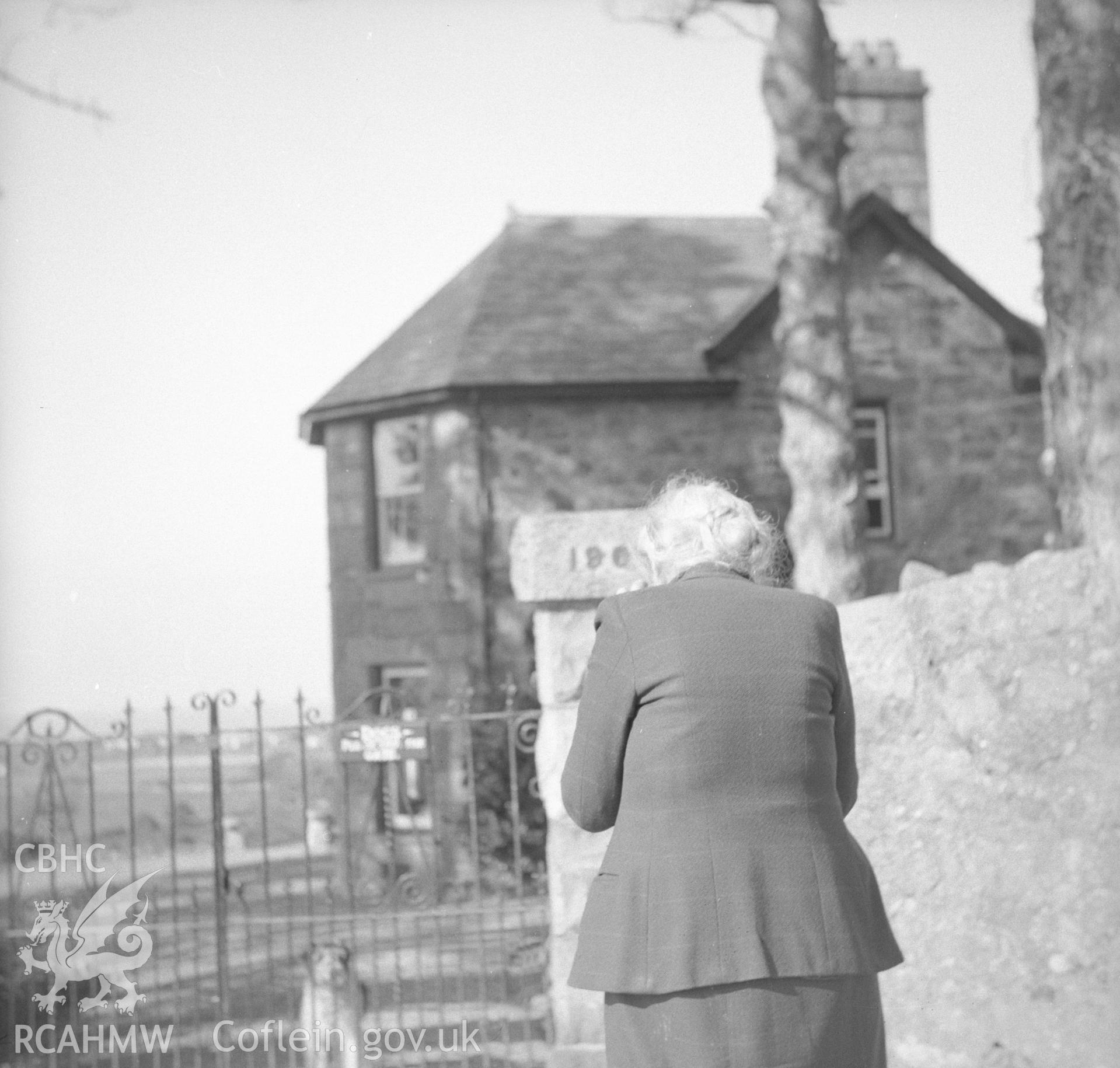 Digital copy of an undated nitrate negative showing view of figure at the entrance of Coed Mawr, Merioneth.