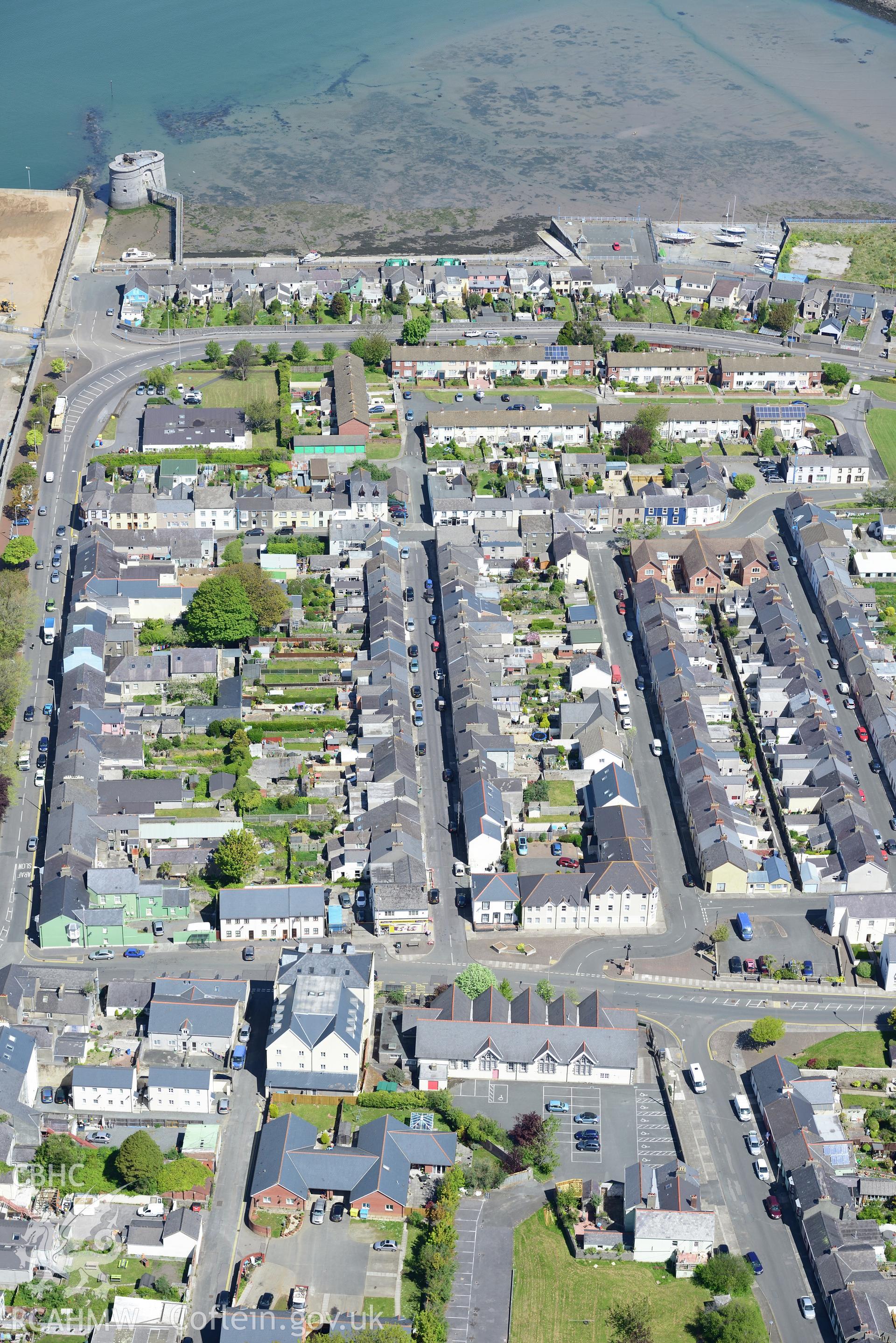 The east martello tower overlooking the sea at the dockyard in Pembroke Dock. Oblique aerial photograph taken during the Royal Commission's programme of archaeological aerial reconnaissance by Toby Driver on 13th May 2015.