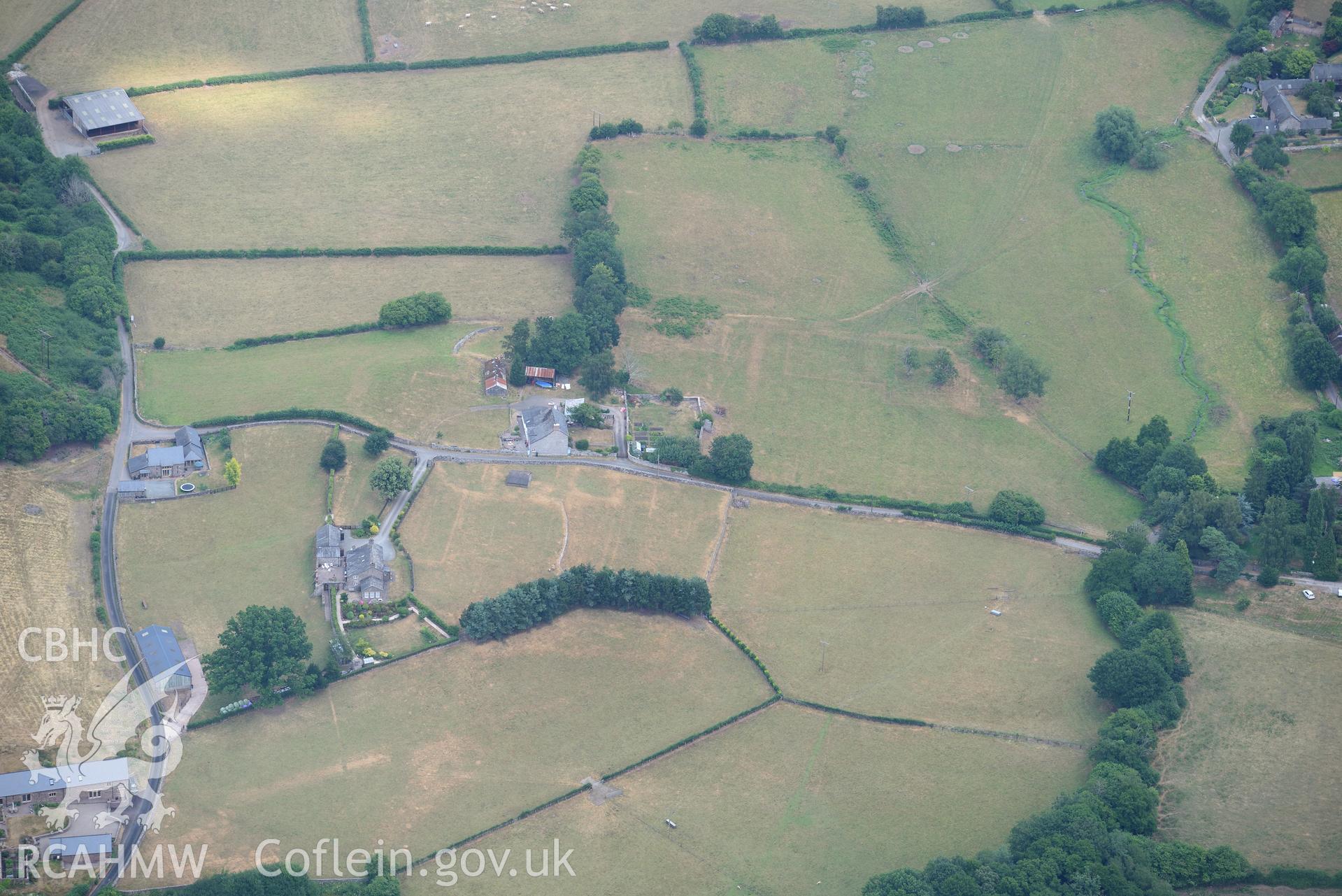 Royal Commission aerial photography of extensive parchmarks at Pen y Gaer Roman fort, including the internal plan and extramural buildings, taken on 19th July 2018 during the 2018 drought.