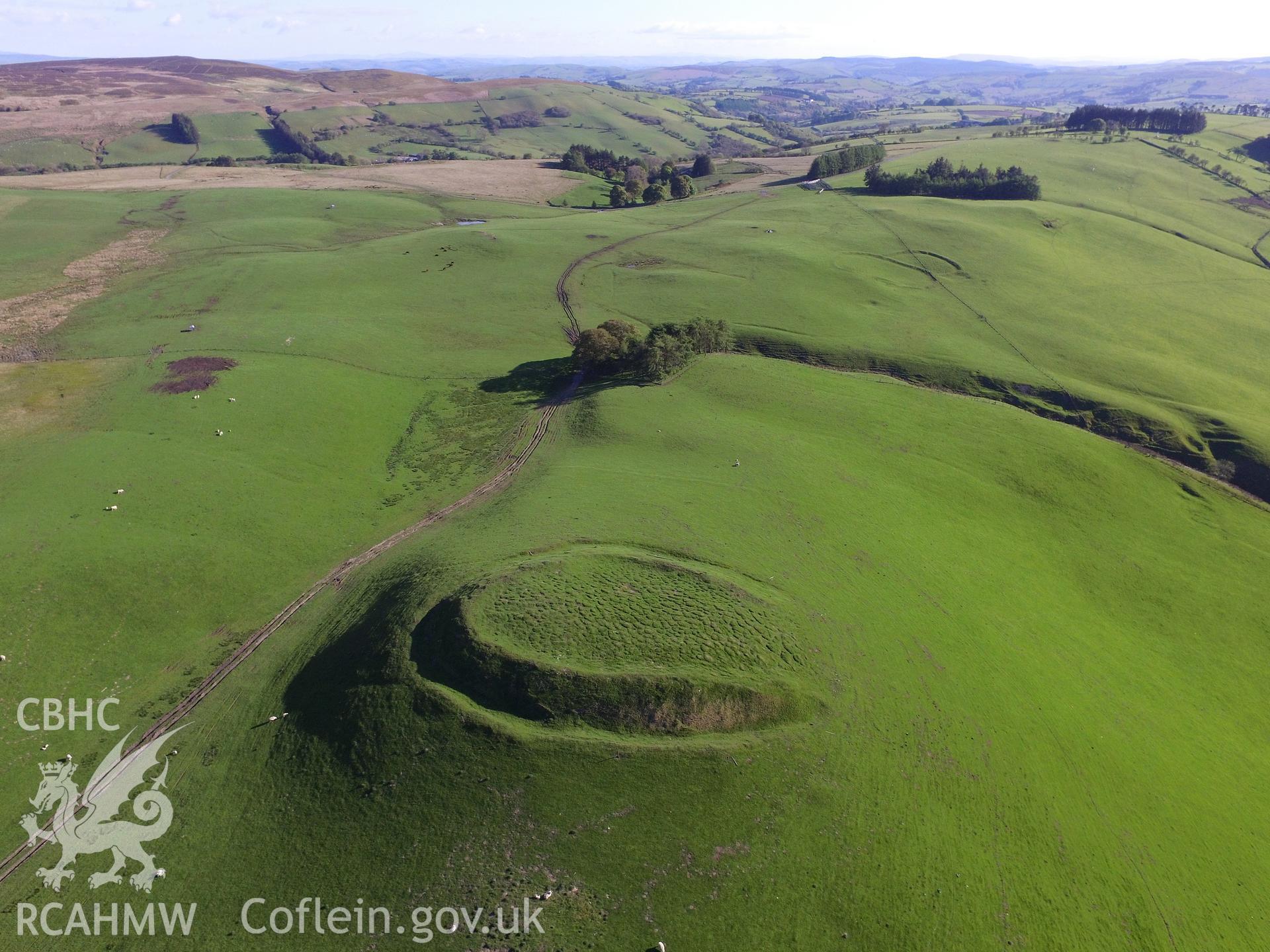 Colour photo showing aerial view of Castell-y-Blaidd, Llanbadarn Fynydd in it's surroundings, taken by Paul R. Davis, 13th May 2018.