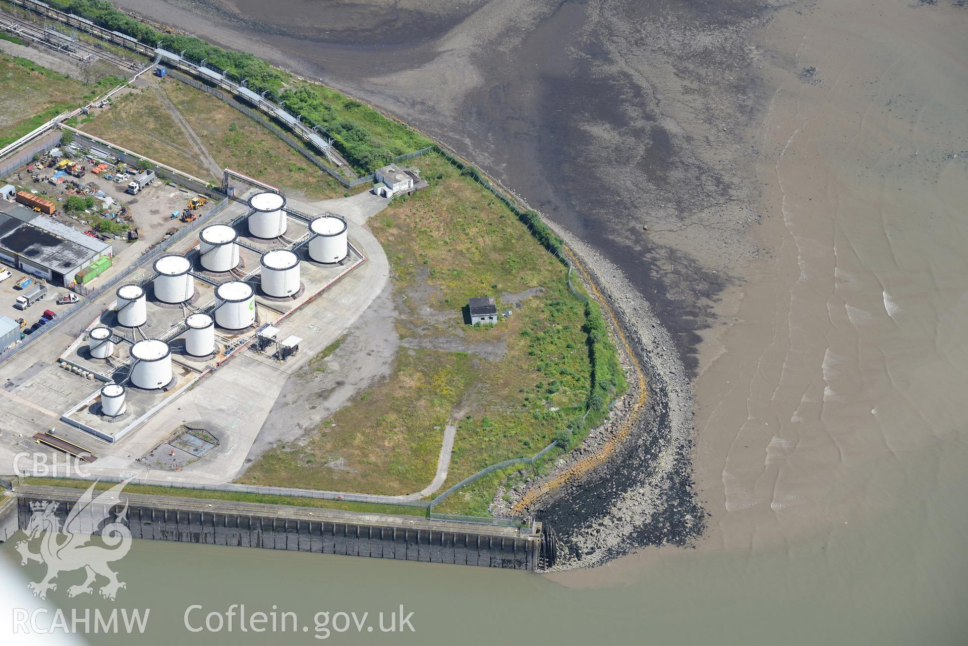 Oil Terminal and Gun Emplacement at Queen Alexandra Dock, Bute Town, Cardiff. Oblique aerial photograph taken during the Royal Commission's programme of archaeological aerial reconnaissance by Toby Driver on 29th June 2015.