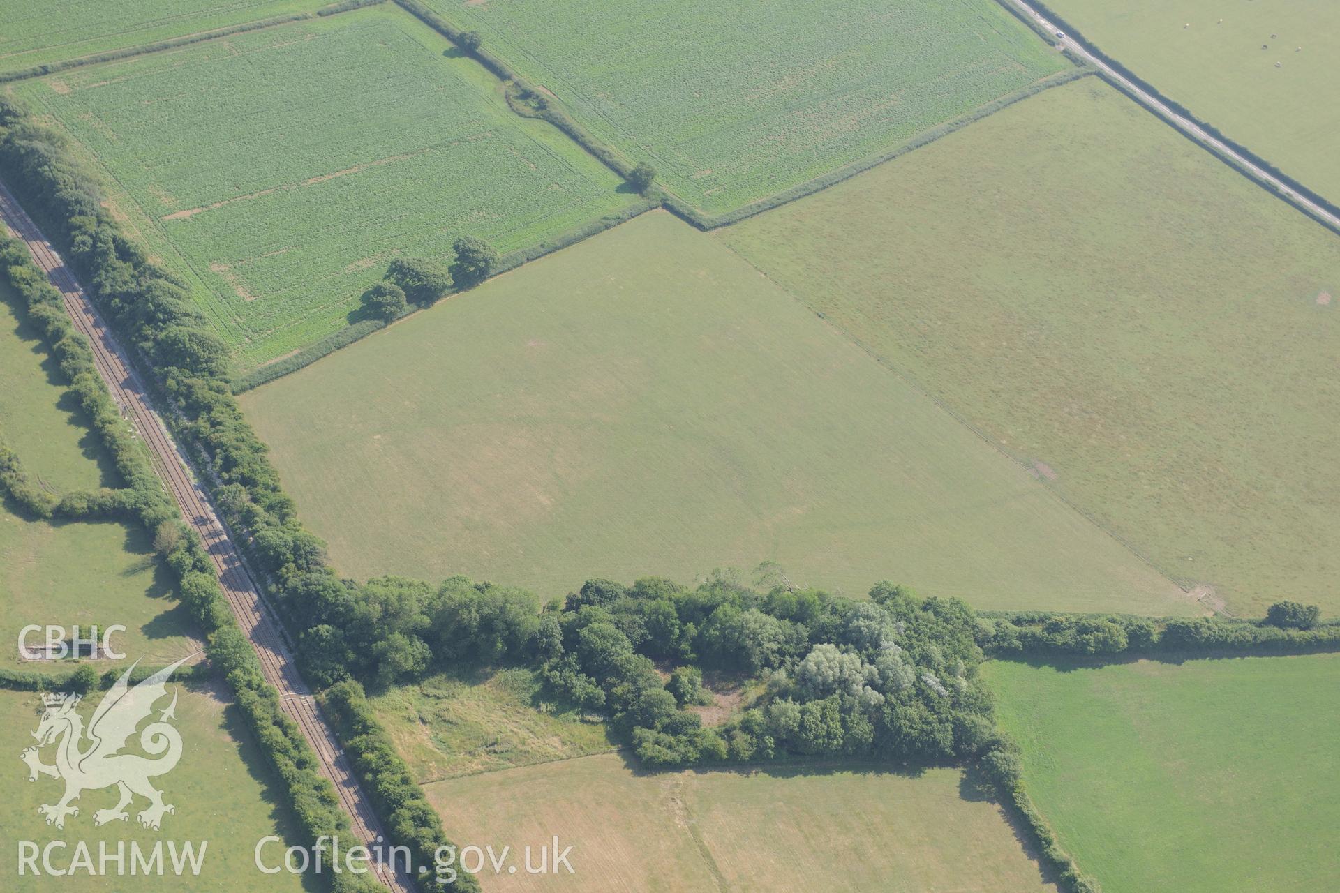 Caermead water lane defended enclosure, north west of Llantwit Major. Oblique aerial photograph taken during the Royal Commission?s programme of archaeological aerial reconnaissance by Toby Driver on 1st August 2013.