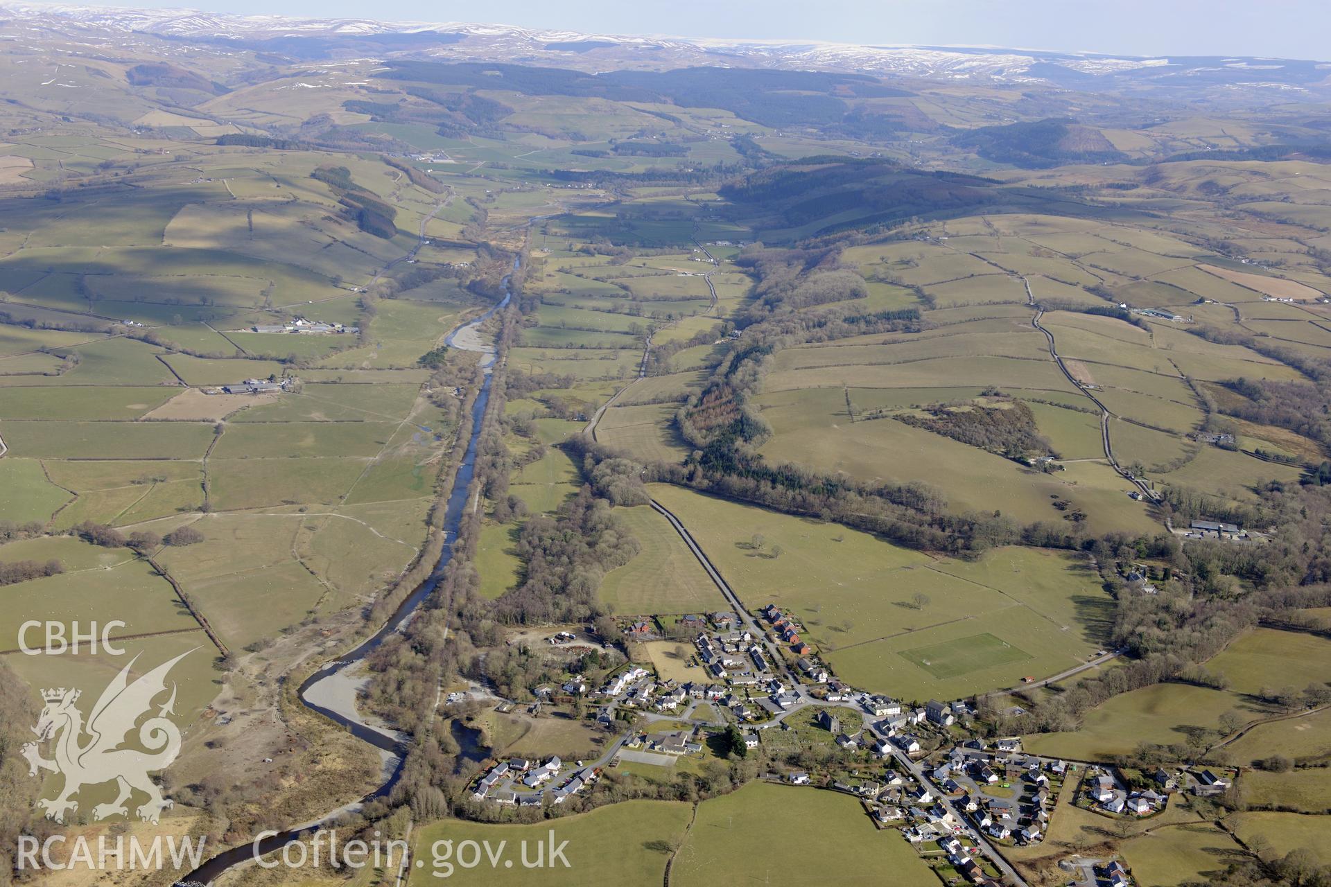 The village of Llanilar, south east of Aberystwyth, with St. Hilary's church at it's centre. Oblique aerial photograph taken during the Royal Commission?s programme of archaeological aerial reconnaissance by Toby Driver on 2nd April 2013.