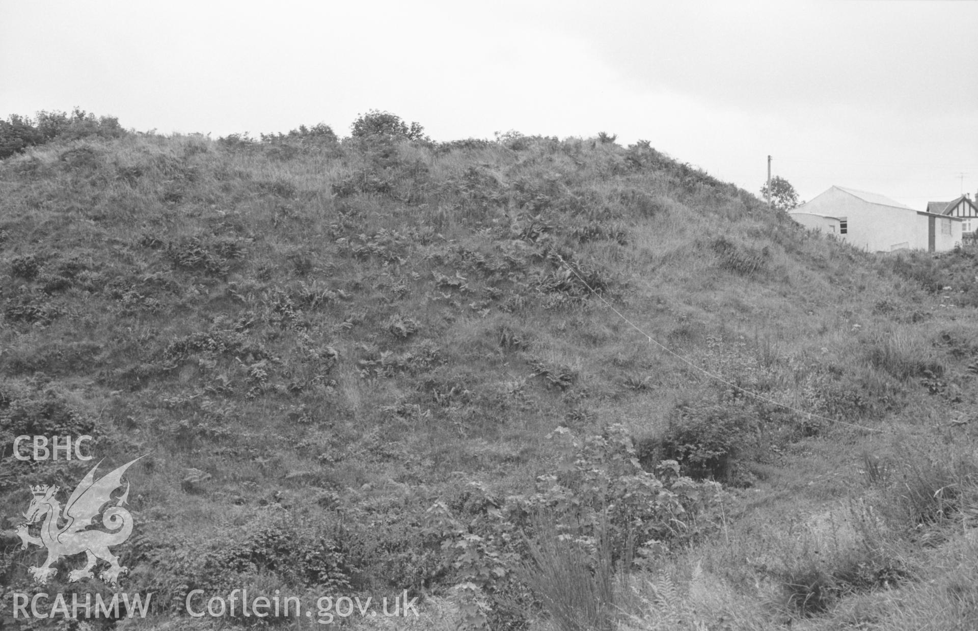 Digital copy of a black and white negative showing Blaenporth castle with Norman motte and bailey. Photographed in August 1963 by Arthur O. Chater from Grid Reference SN 2662 4888, looking south south east. (Panorama, photograph 2 of 2).